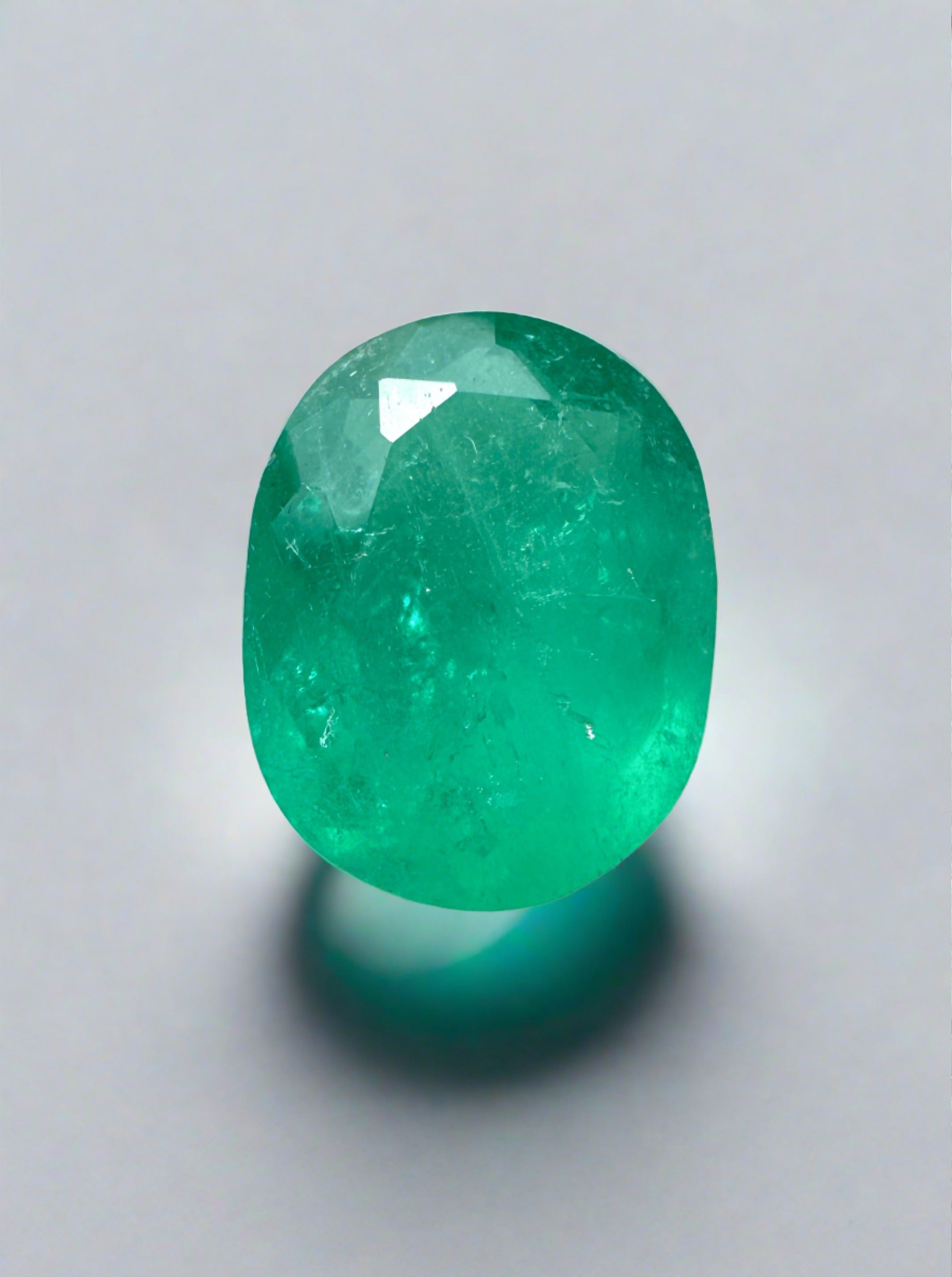 Medium bluish green 2.11 carat oval cut Colombian emerald loose gemstone from JR Colombian Emeralds, natural and unmounted.