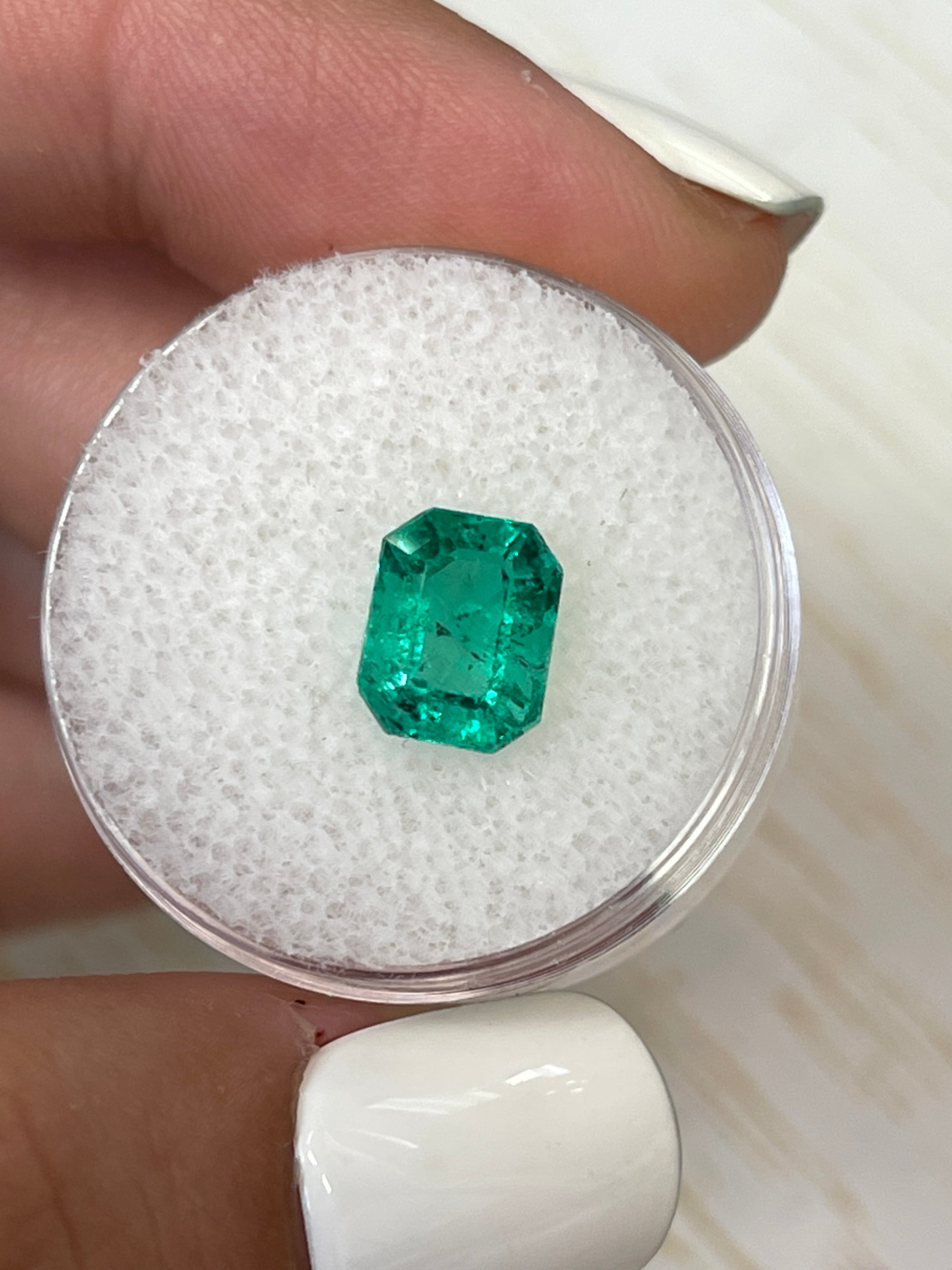 2.12 carat bluish green natural Colombian emerald loose gemstone in emerald cut with freckled inclusions, from JR Colombian Emeralds.