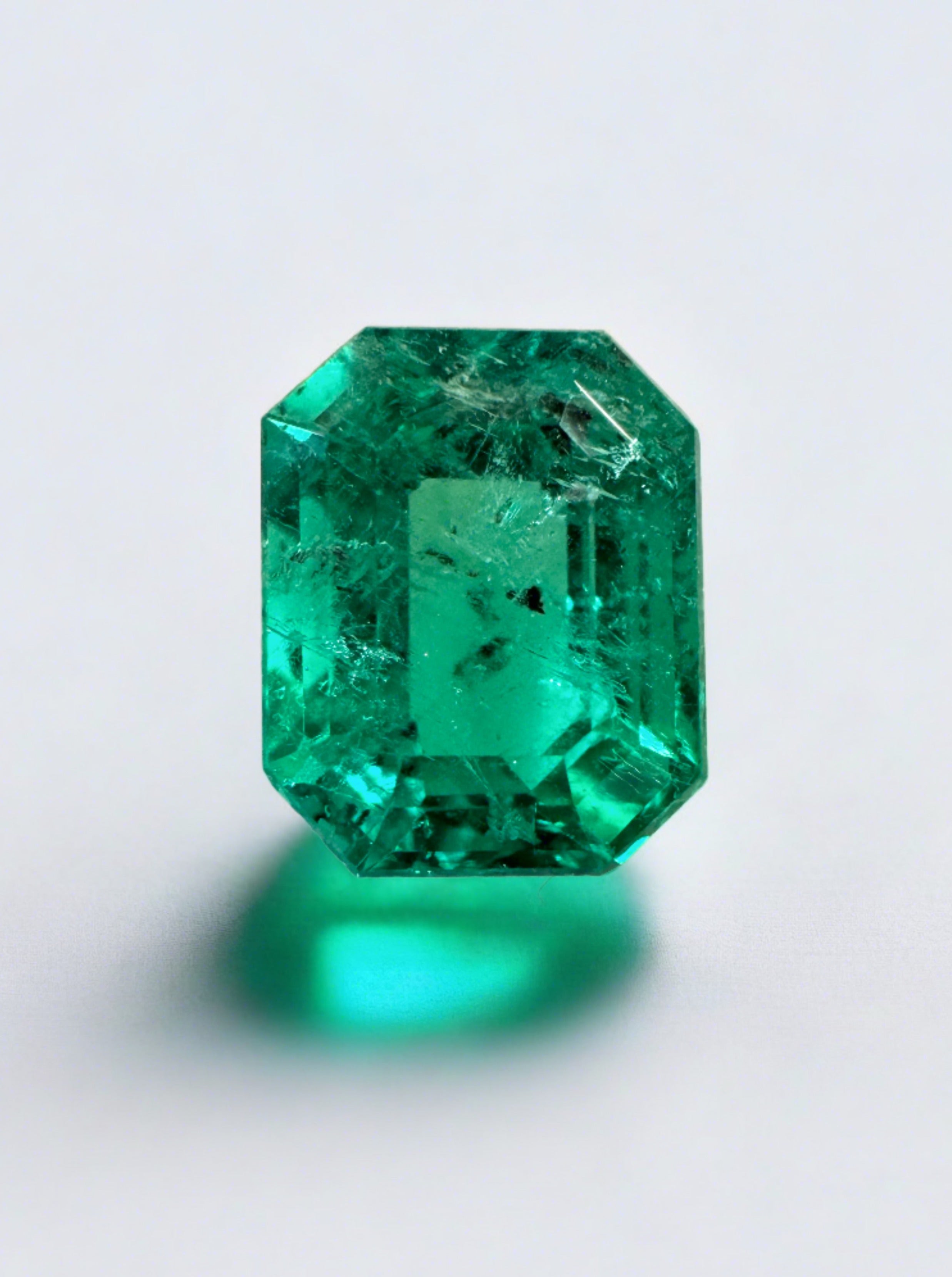2.12 carat freckled bluish green Colombian emerald in emerald cut, natural loose gemstone from JR Colombian Emeralds
