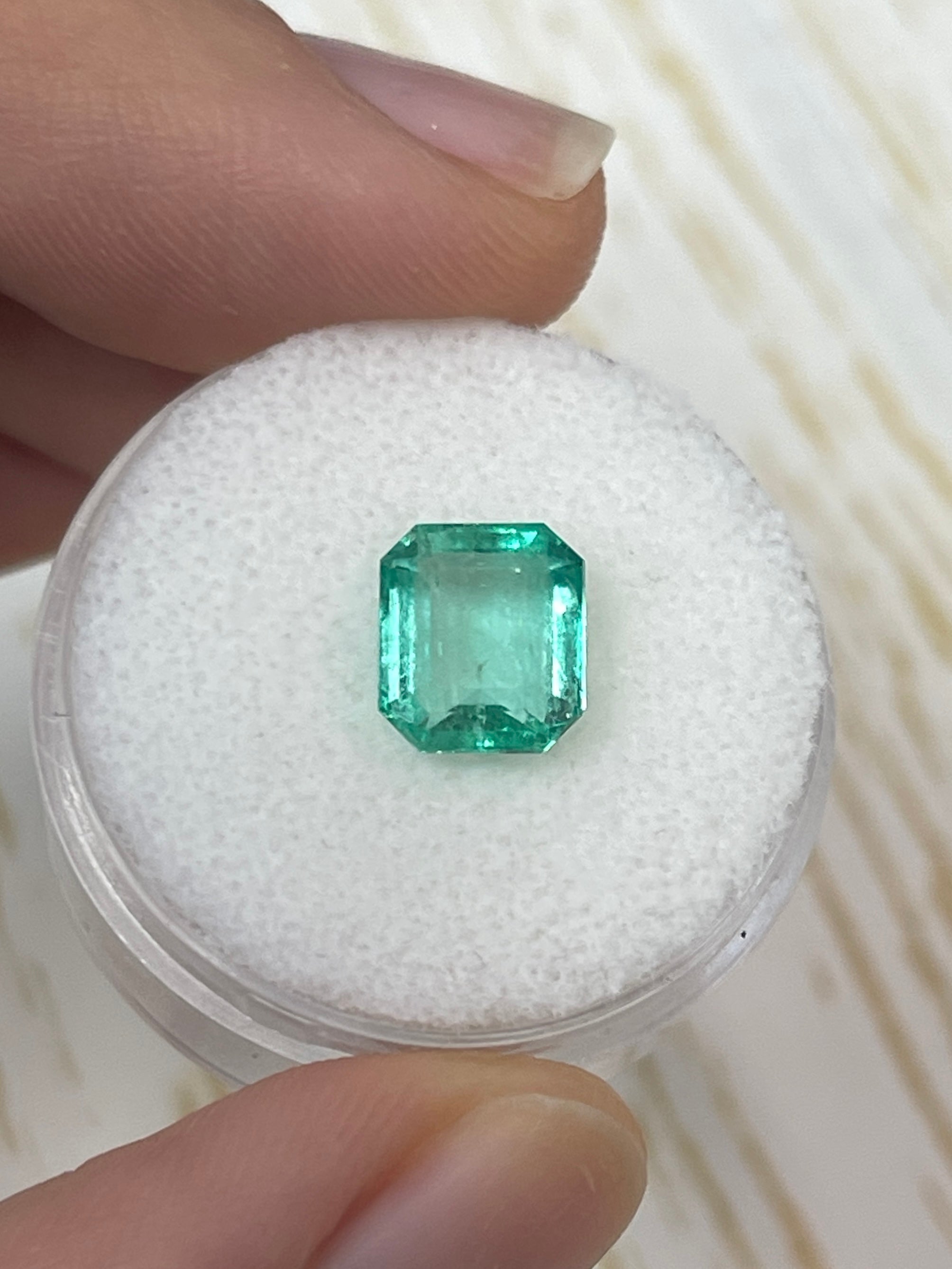 2.15 carat natural Colombian emerald loose gemstone with a chunky, 8.5x7.5 mm portrait cut, showcasing vibrant green color.