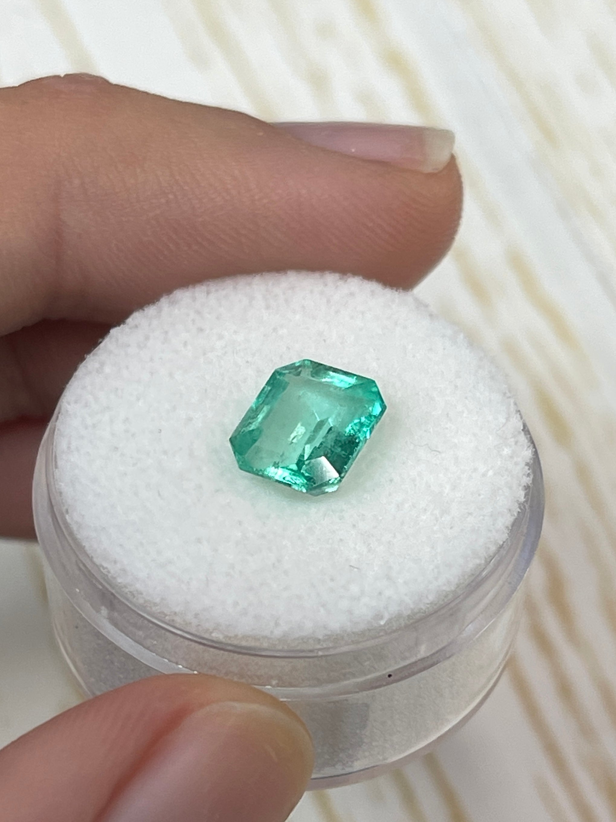2.15 Carat natural Colombian emerald loose gemstone in a chunky emerald cut, showcasing vibrant green color and clarity.