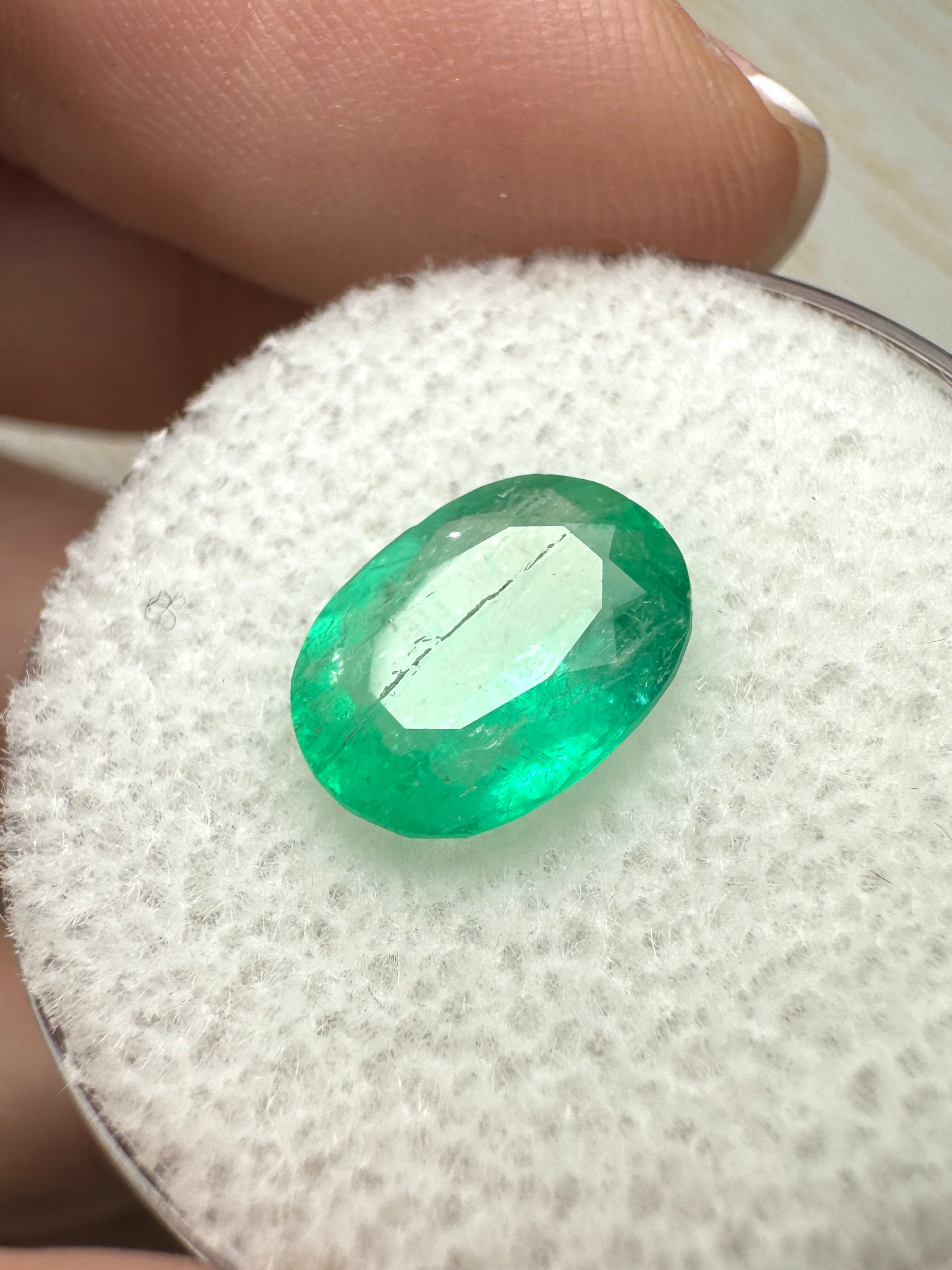 Oval cut 2.19 carat green natural Colombian emerald loose gemstone from JR Colombian Emeralds, showcasing vibrant color and clarity.