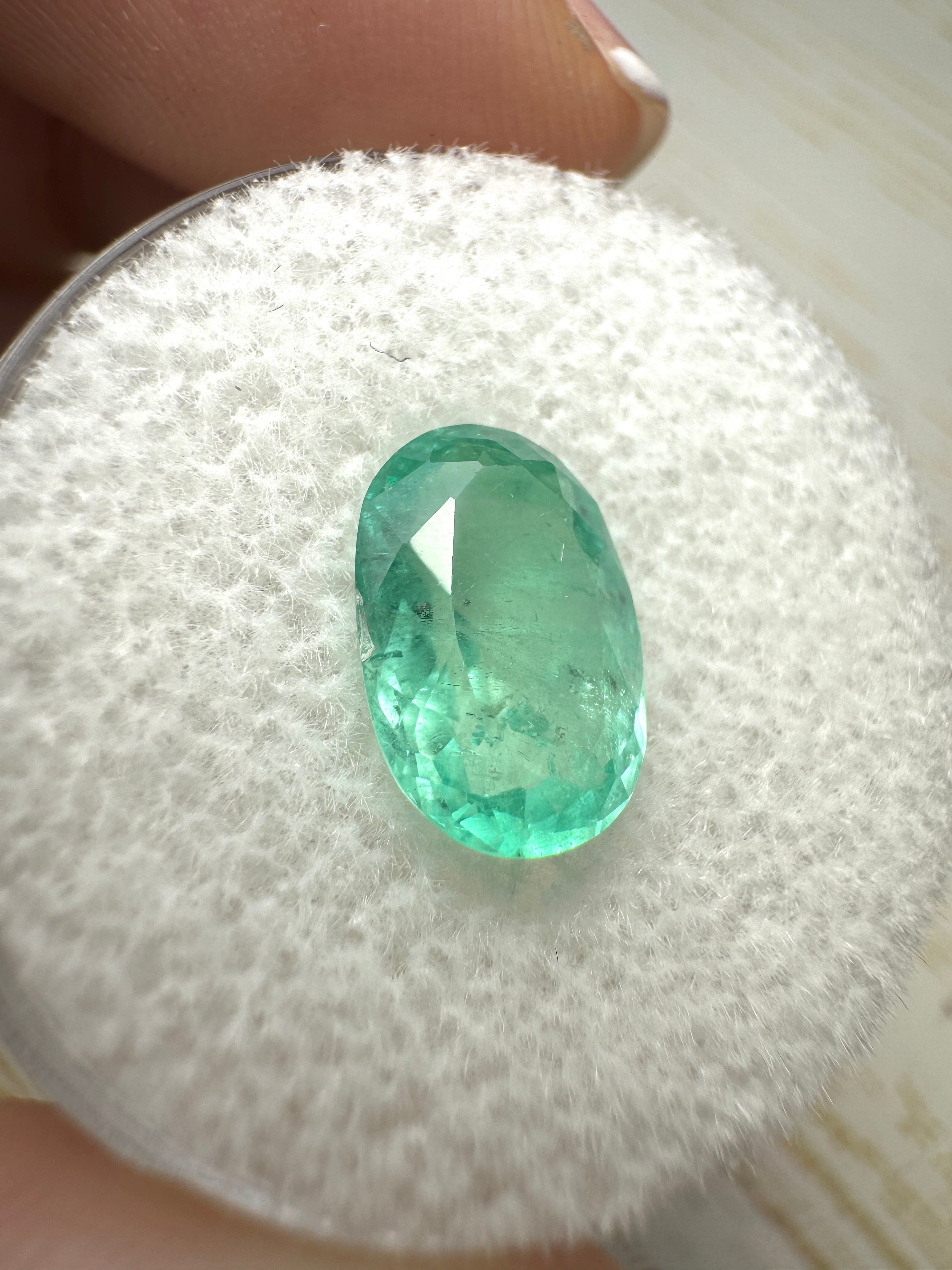 Light bluish green 2.22 carat oval cut Colombian emerald from JR Colombian Emeralds, natural loose gemstone.