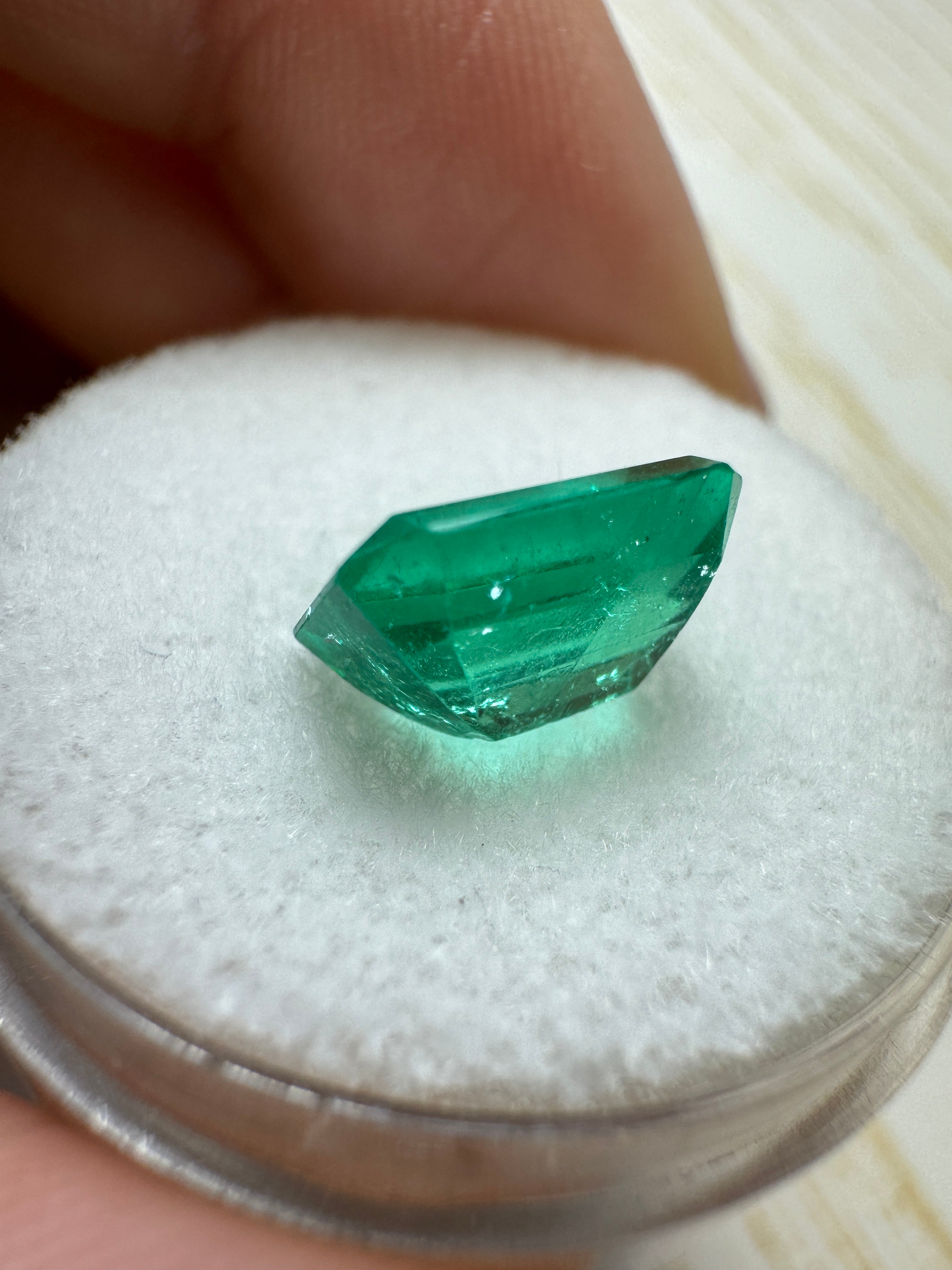 2.27 Carat Muzo medium green Colombian emerald loose gemstone with emerald cut, natural and vibrant, from JR Colombian Emeralds.