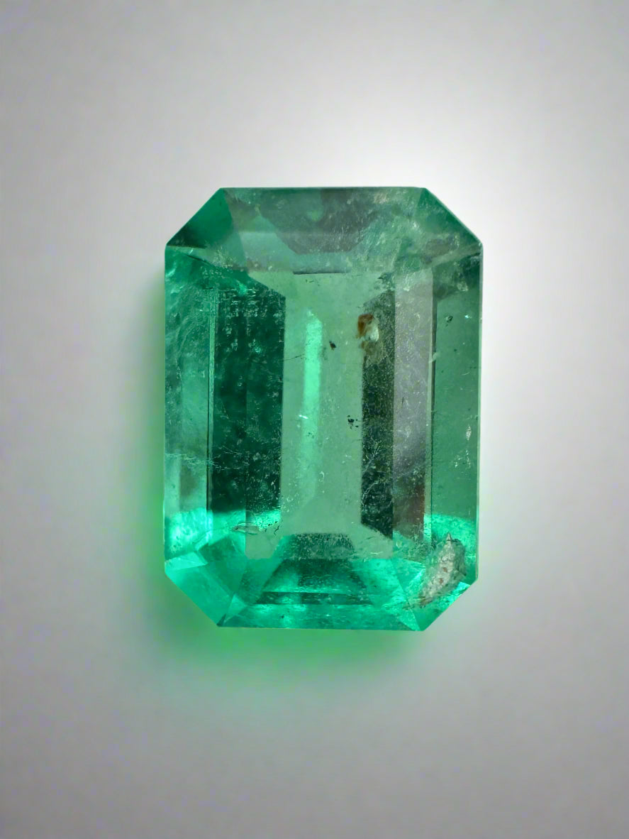 Medium green Colombian emerald cut gemstone, 2.31 carats, freckled surface, from JR Colombian Emeralds