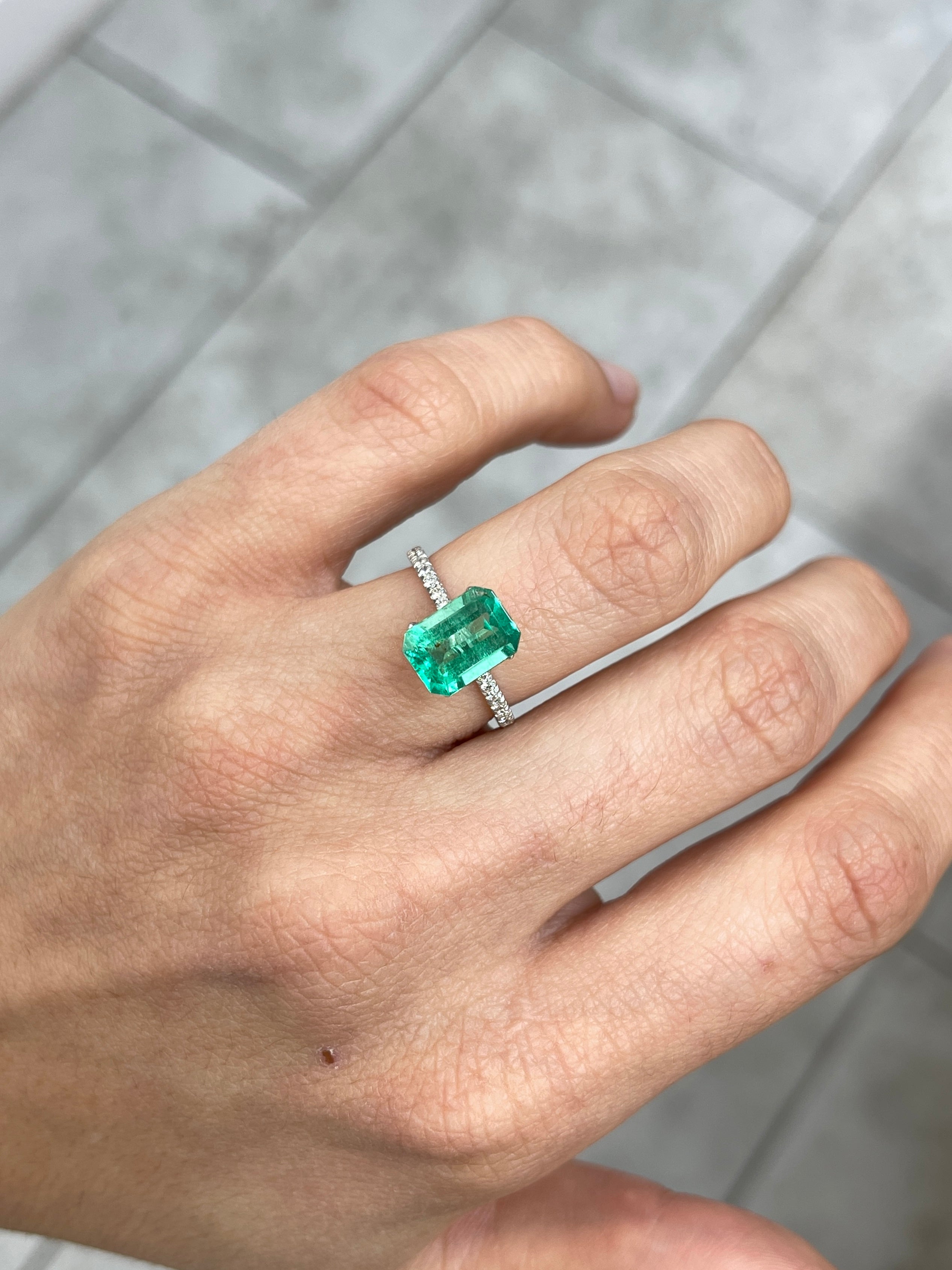 Medium green Colombian emerald cut gemstone, 2.31 carats, with natural freckles and a 10x7 size, by JR Colombian Emeralds.