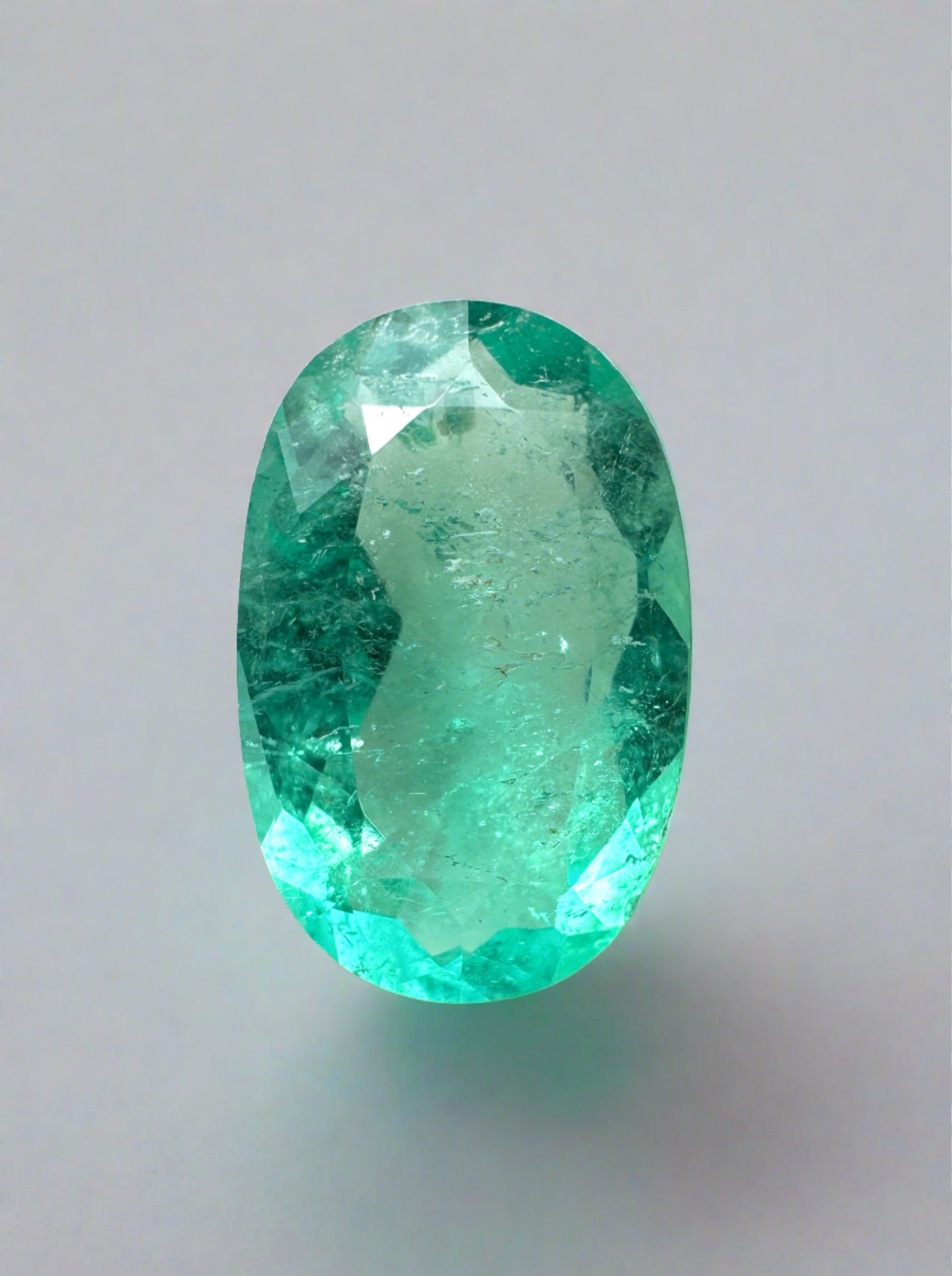 2.31 carat elongated oval Colombian emerald loose gemstone from JR Colombian Emeralds, vibrant green natural color.
