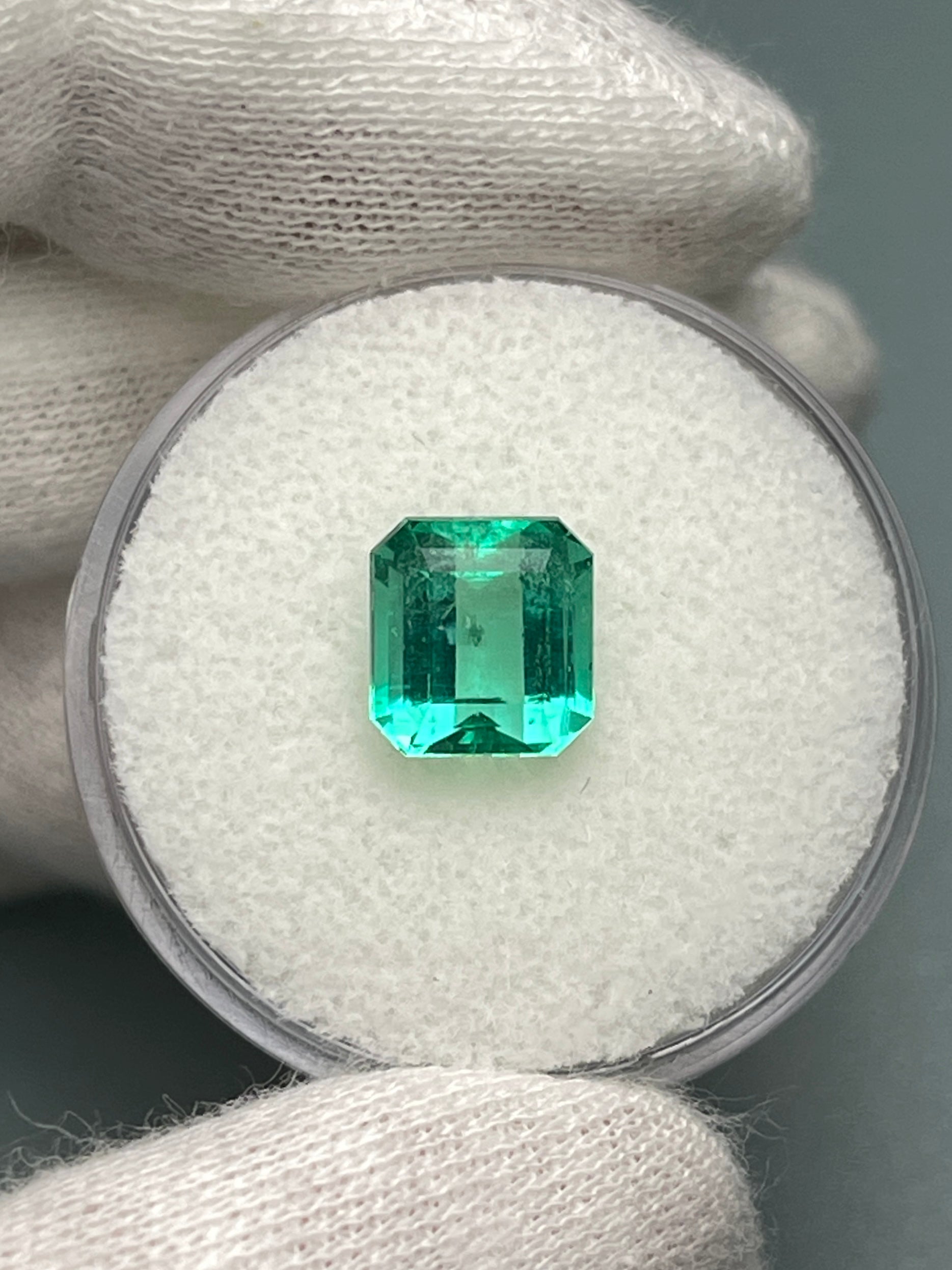 2.36 Carat natural loose Colombian emerald in Asscher cut, showcasing vibrant green color and clarity, from JR Colombian Emeralds.