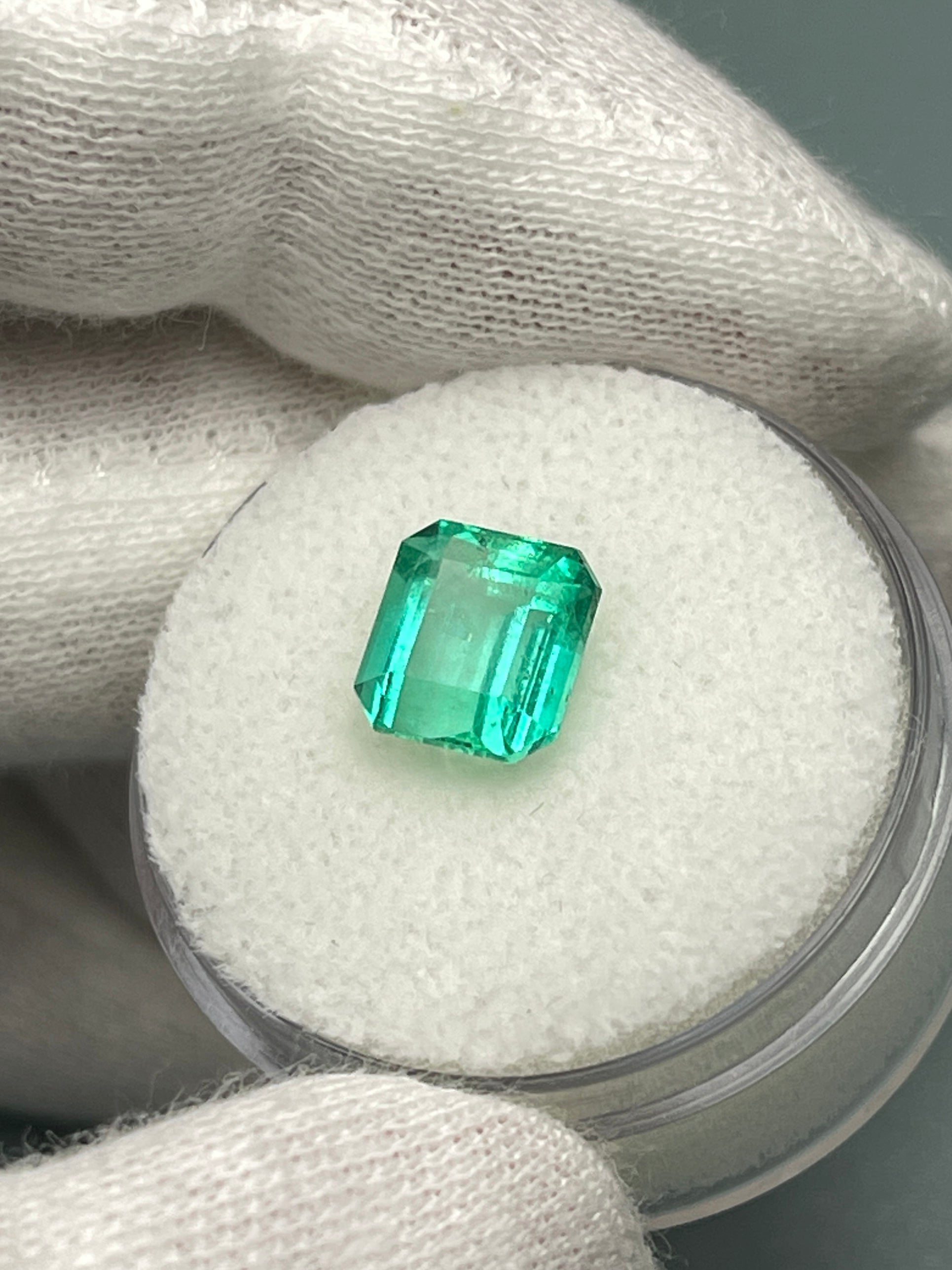 2.36 carat natural loose Colombian emerald in Asscher cut, showcasing vibrant green gemstone from JR Colombian Emeralds.