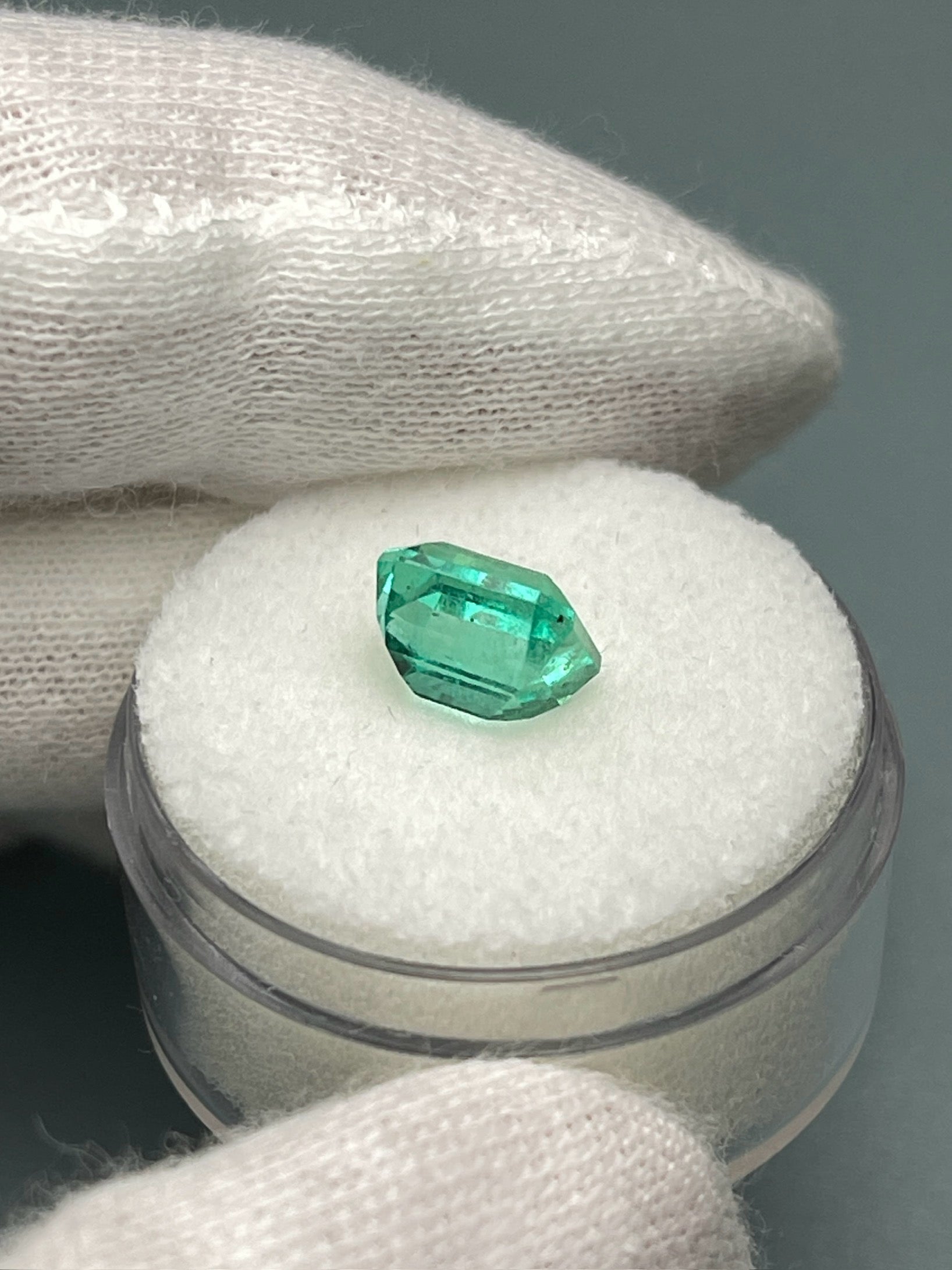 Natural 2.36 carat loose Colombian emerald in Asscher cut, showcasing vibrant green color and clarity from JR Colombian Emeralds.