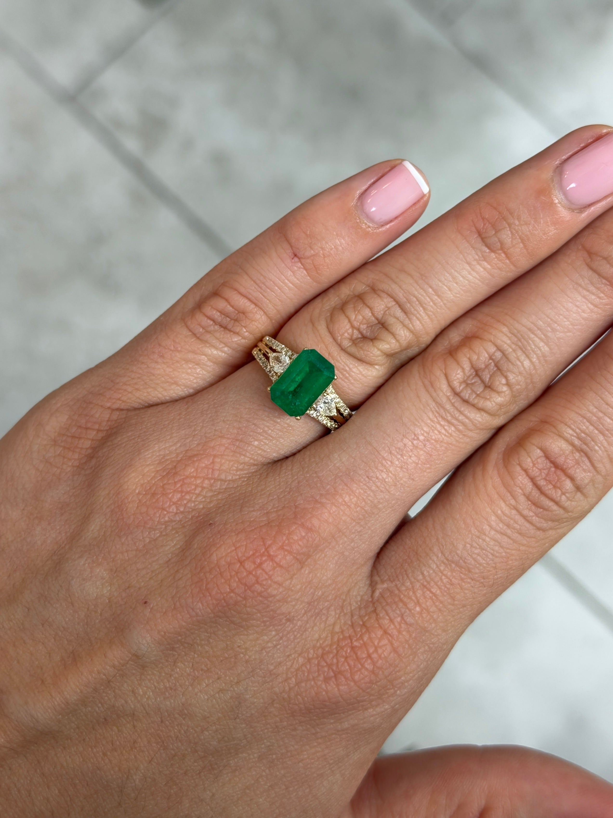 Deep jungle green 2.40 carat natural Colombian emerald loose gemstone in elongated emerald cut, from JR Colombian Emeralds.