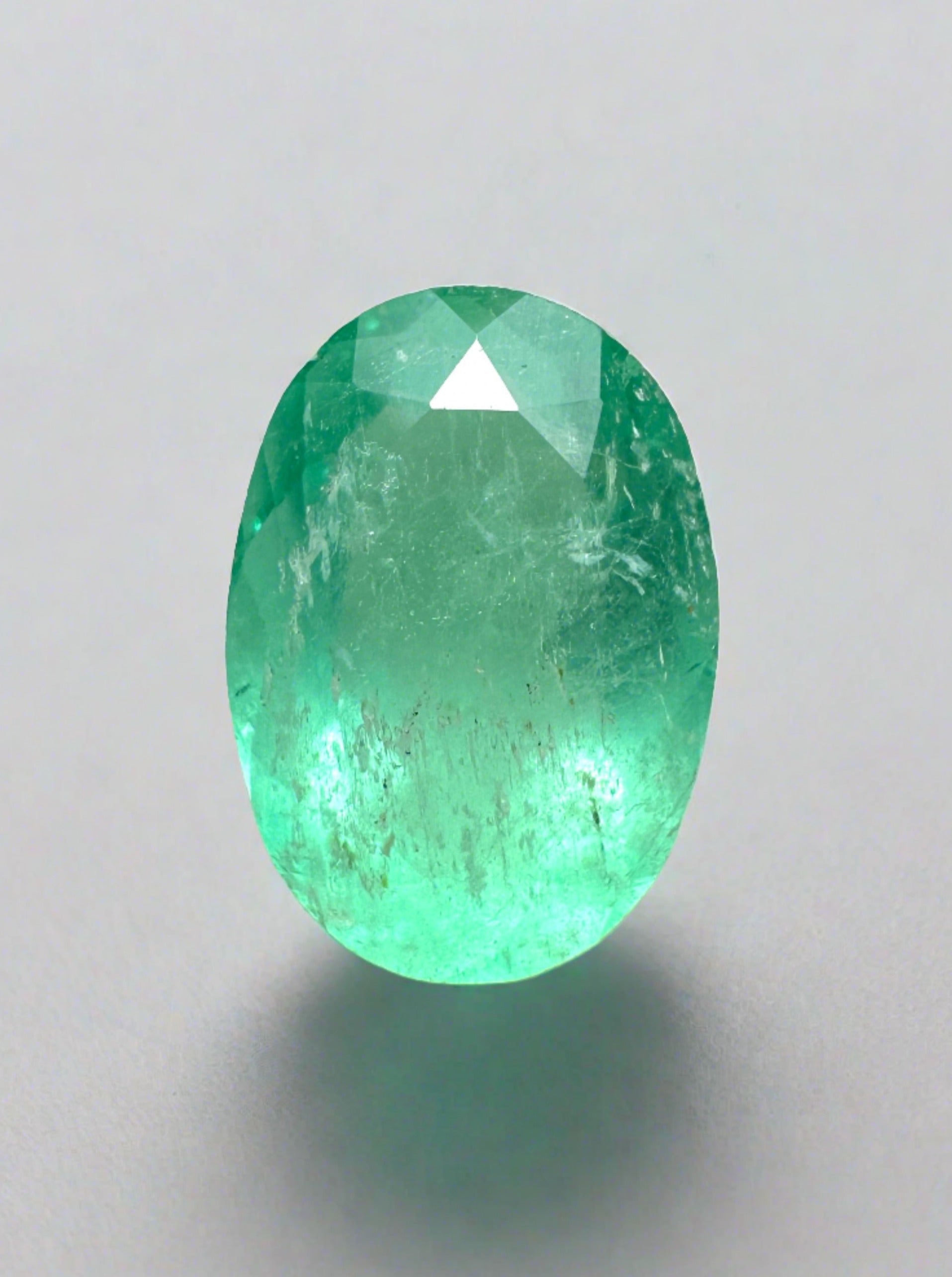 2.40 carat medium light green Colombian emerald in oval cut, loose gemstone from JR Colombian Emeralds.