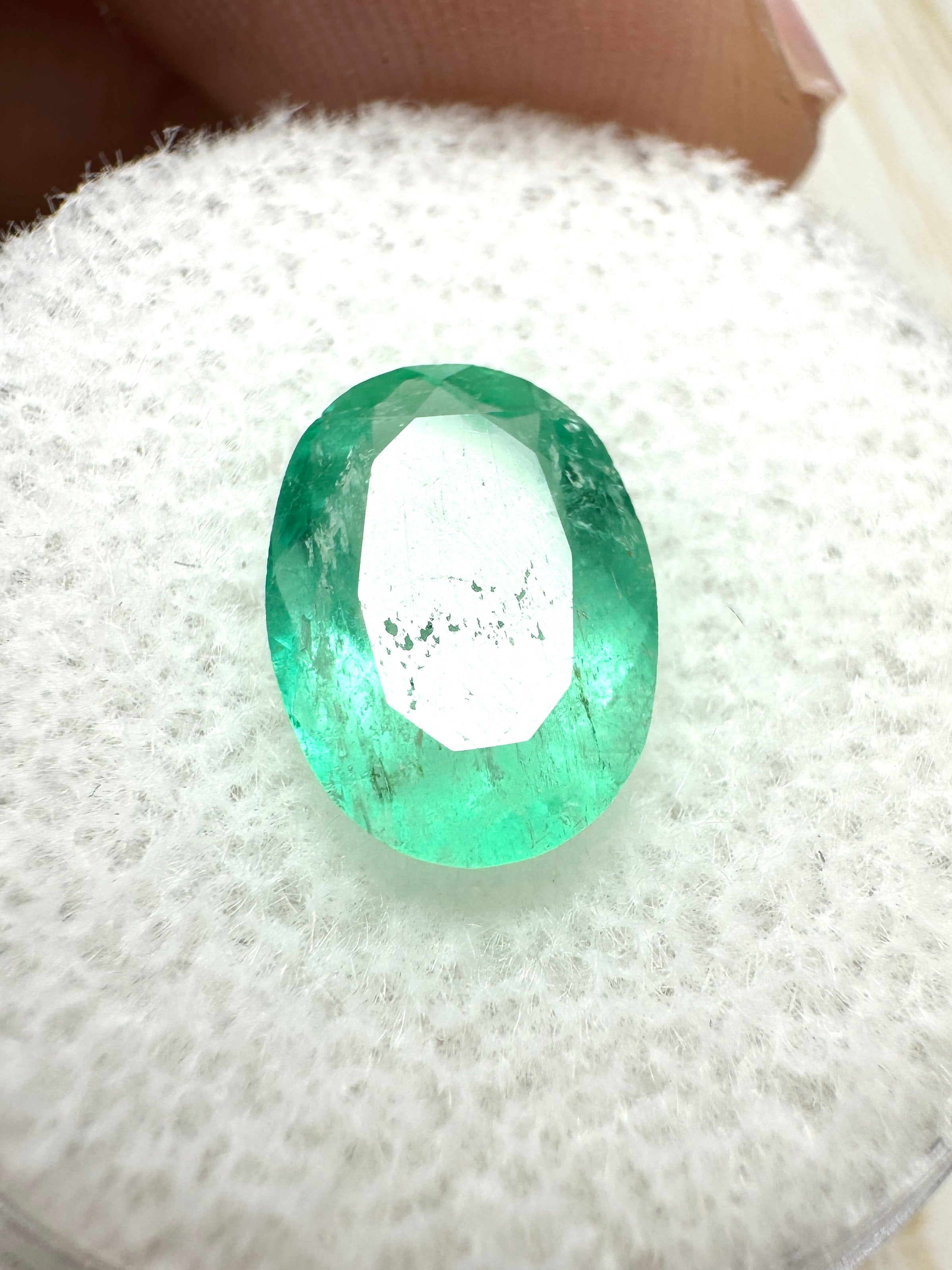 2.40 carat slender medium light green Colombian emerald in oval cut, loose gemstone from JR Colombian Emeralds.