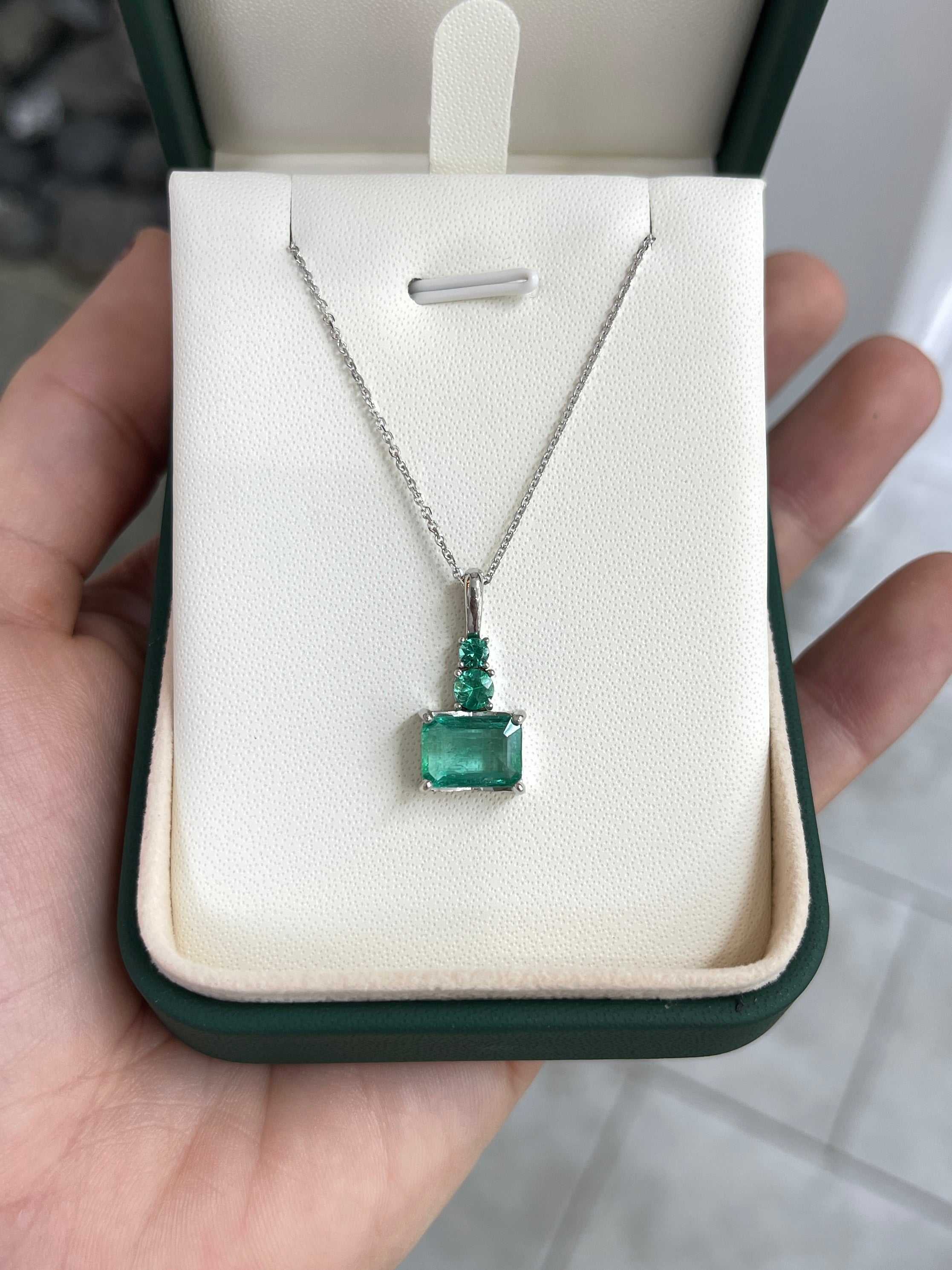 JR Colombian Emeralds 14K white gold necklace with 2.43tcw East-to-West emerald and round emerald accent pendant.