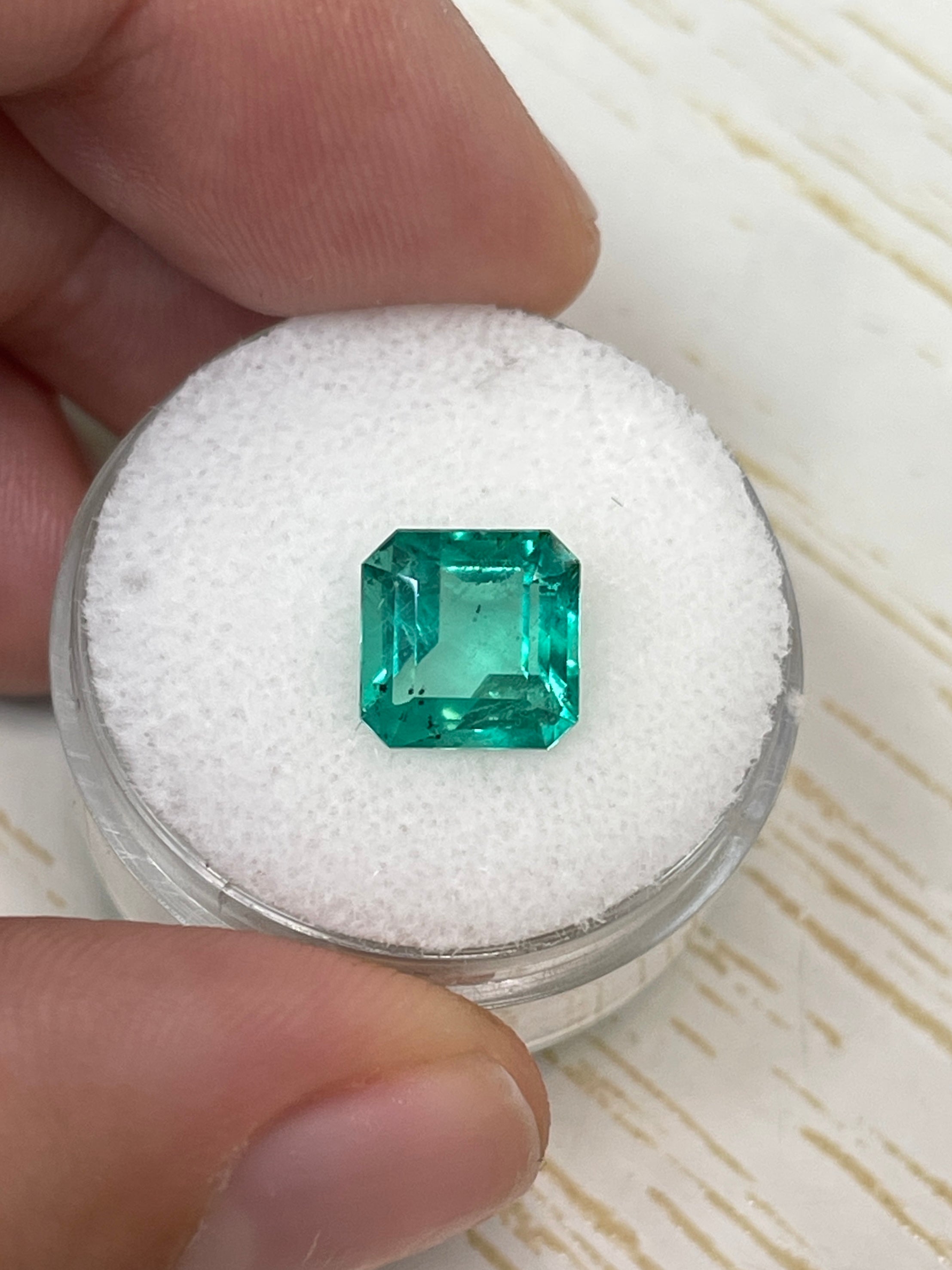 Natural 2.44 Carat bluish green Colombian emerald loose Asscher cut with natural freckles, from JR Colombian Emeralds.