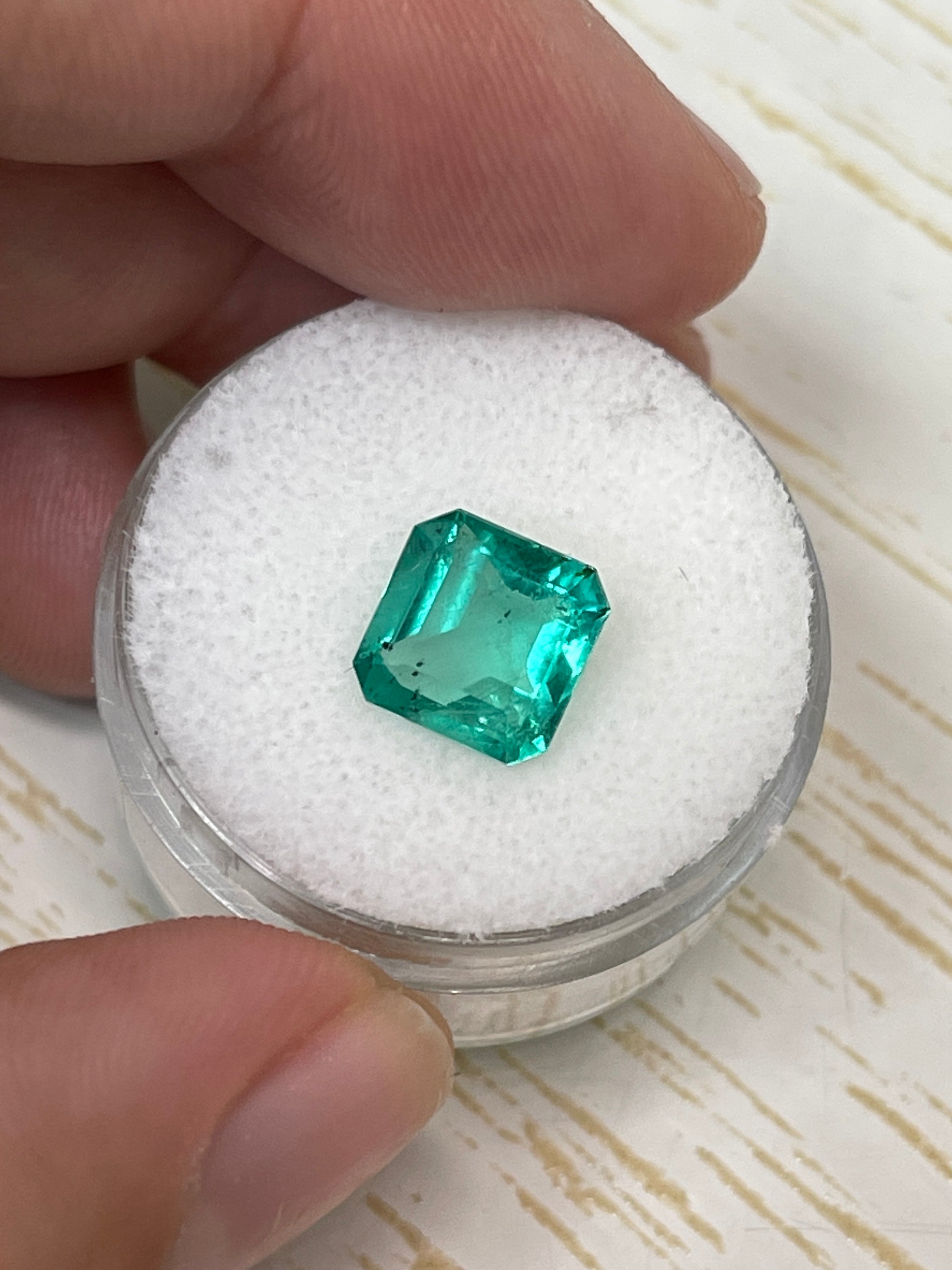 Natural loose Colombian emerald, 2.44 carats, bluish green, freckled, Asscher cut from JR Colombian Emeralds.