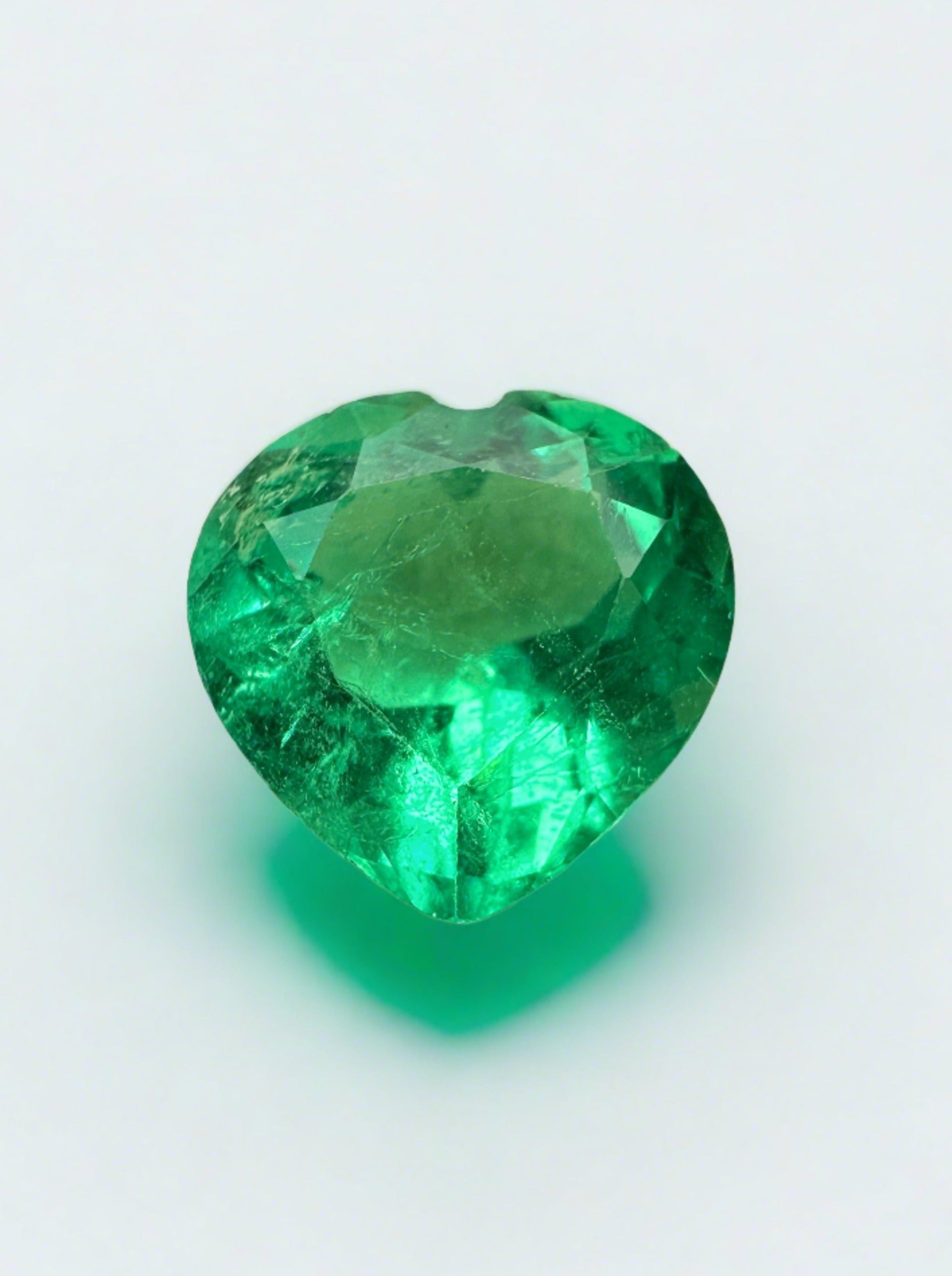 9x9mm yellowish green Colombian emerald loose heart-cut 2.45 carats from JR Colombian Emeralds.