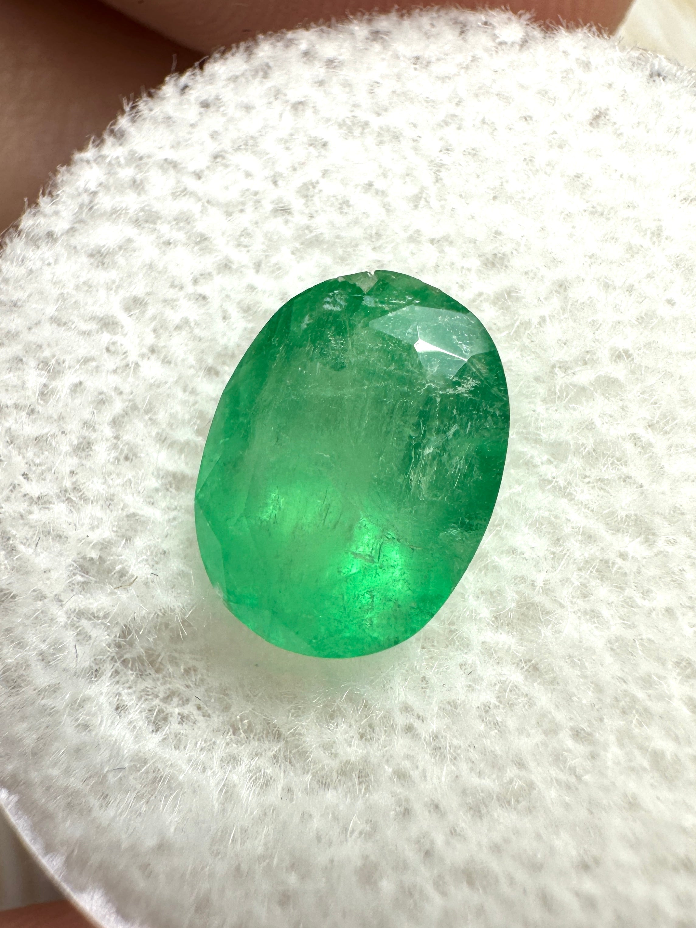 2.52 Carat mossy yellowish green oval Colombian emerald, natural loose gemstone from JR Colombian Emeralds.