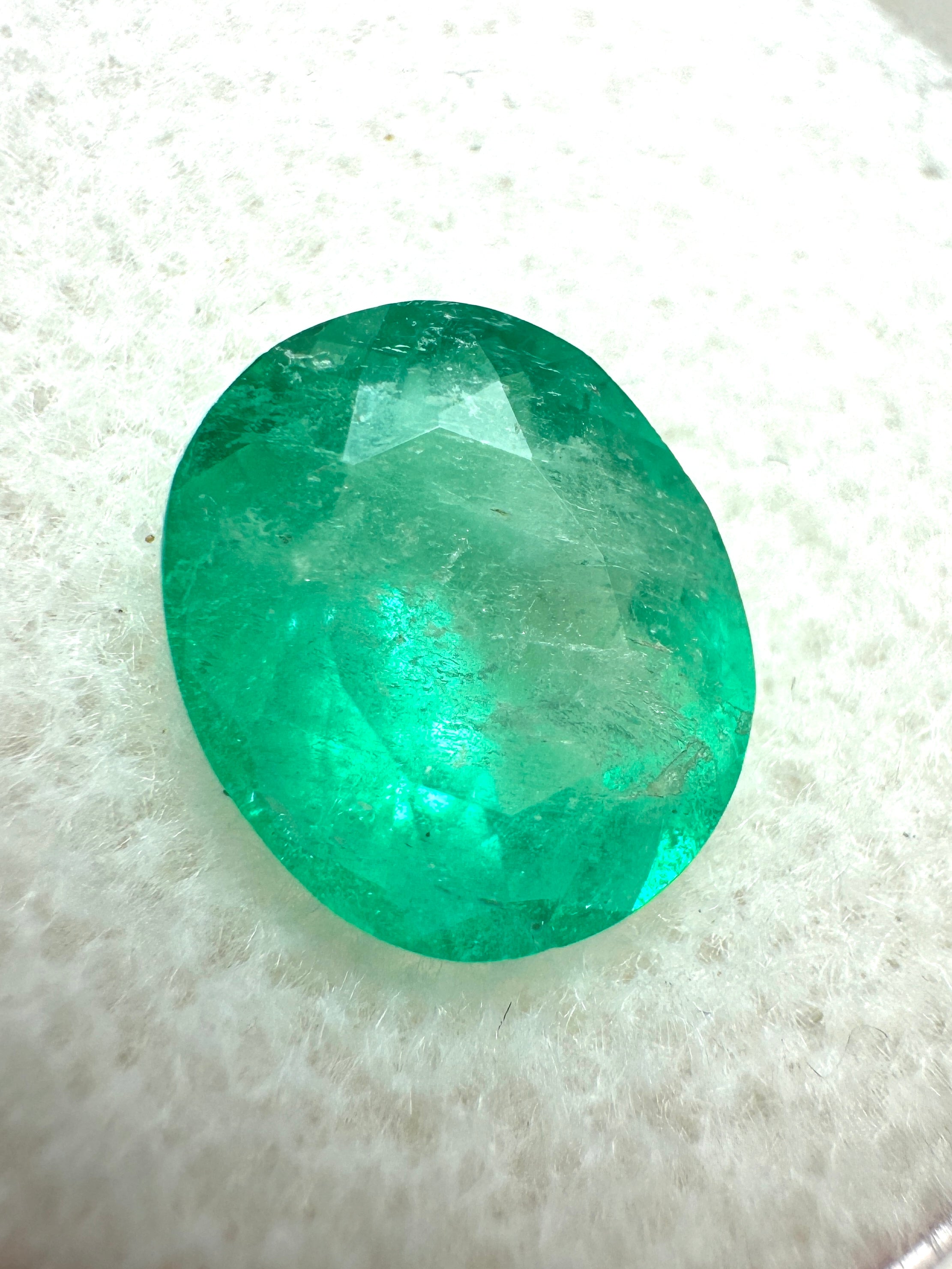 2.53 carat oval cut green Colombian emerald loose gemstone from JR Colombian Emeralds, natural and vibrant with rich green color.