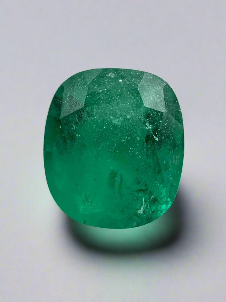 Deep green 2.55 carat natural Colombian emerald in cushion cut, loose gemstone with vibrant color and clarity.