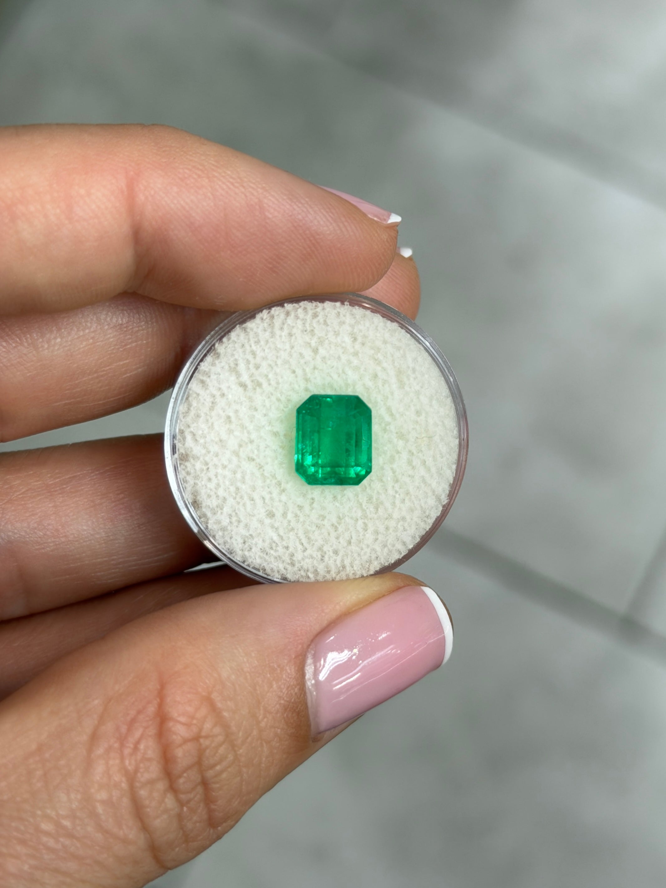 2.57 carat natural vivid Colombian emerald gemstone in 9x7 emerald cut with yellowish green color, from JR Colombian Emeralds.