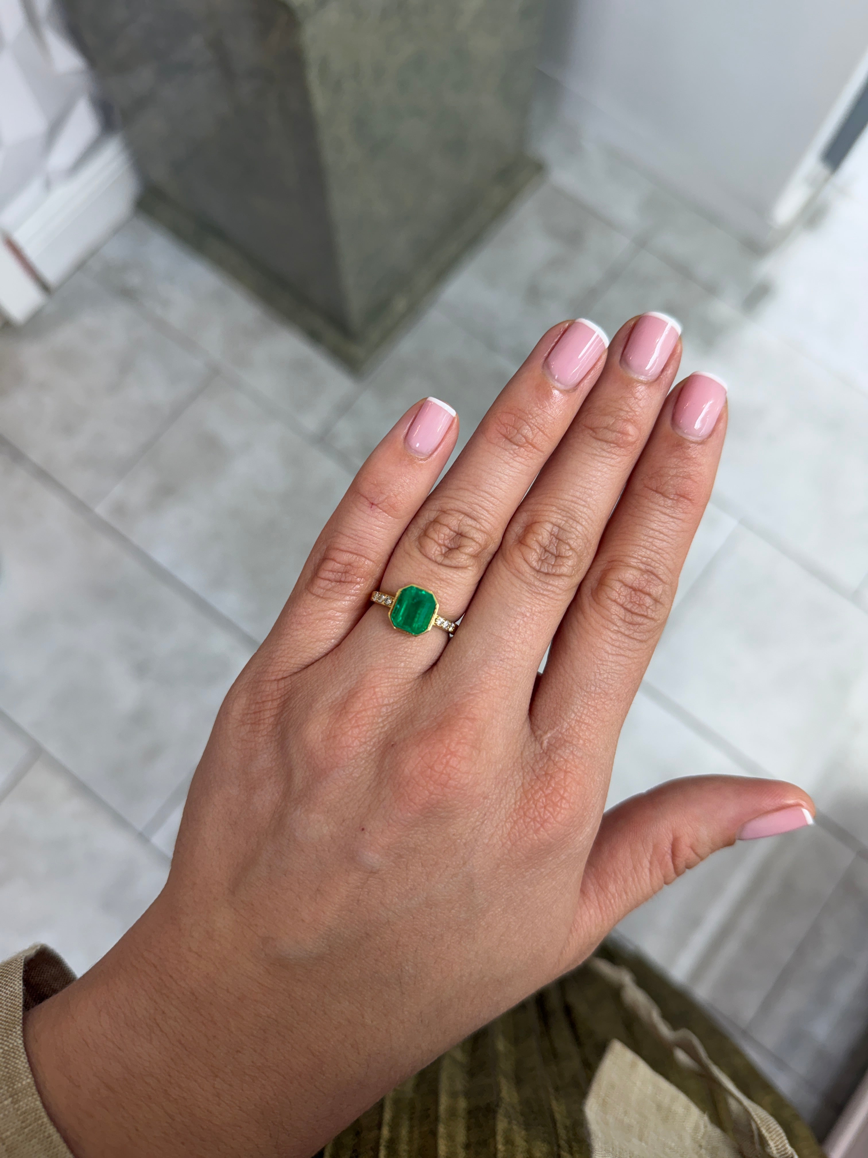 2.57 Carat natural vivid Colombian emerald loose gemstone, 9x7 mm emerald cut, yellowish green color, from JR Colombian Emeralds.