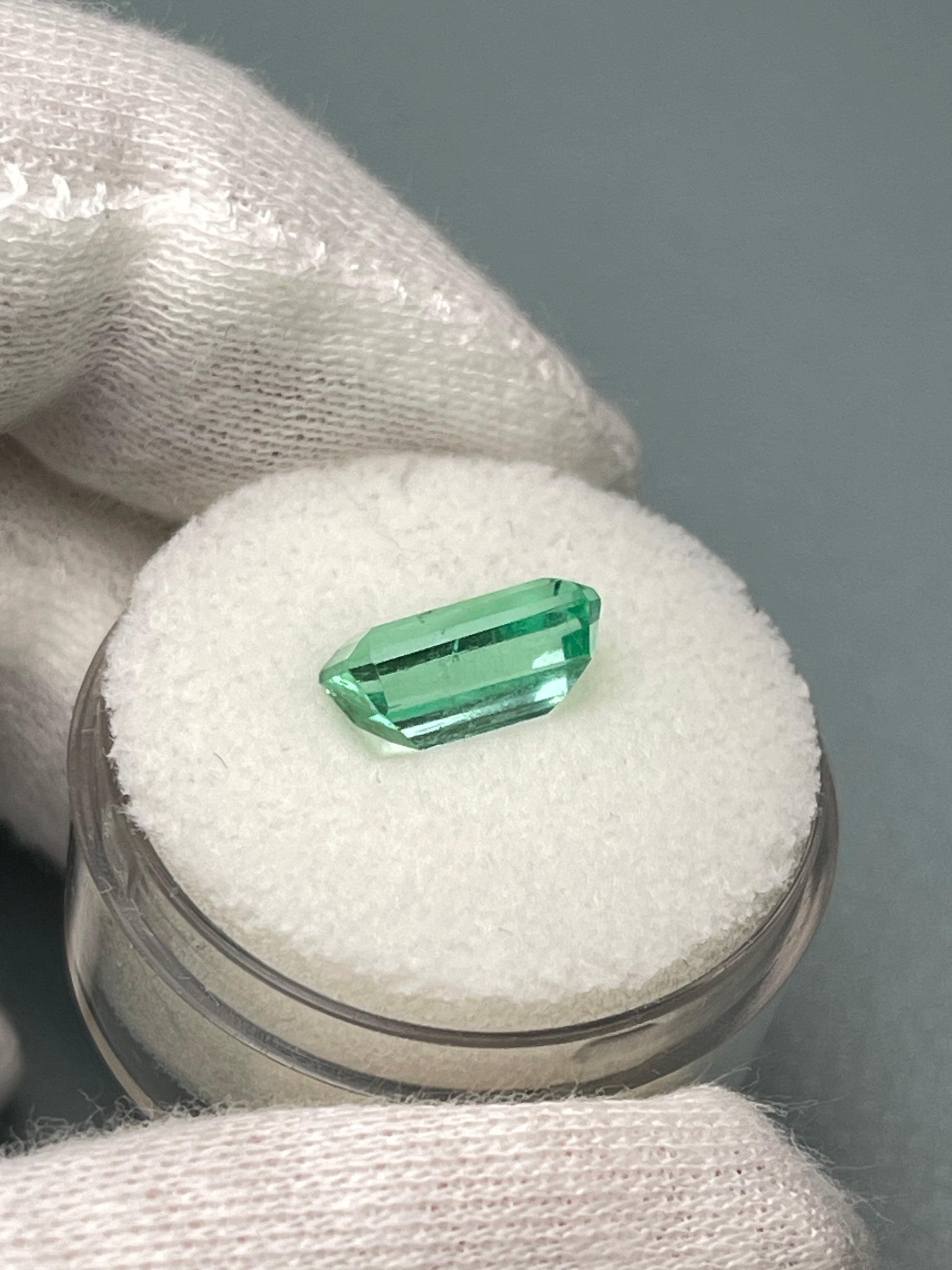 2.64 Carat pastel yellowish-green Colombian emerald in an emerald cut, showcasing clarity and vibrant color, by JR Colombian Emeralds.