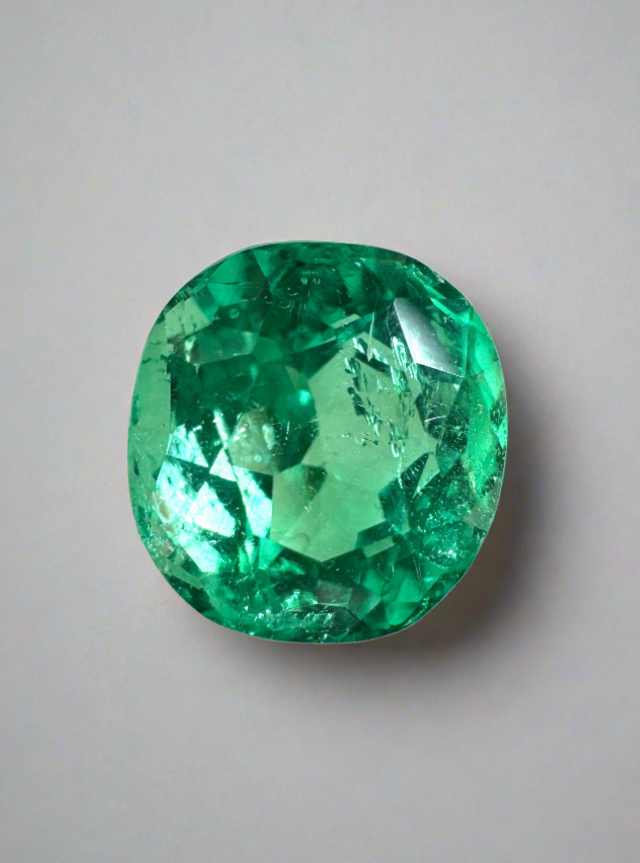 2.67-carat glowing Muzo green Colombian emerald loose cushion cut gemstone from JR Colombian Emeralds.