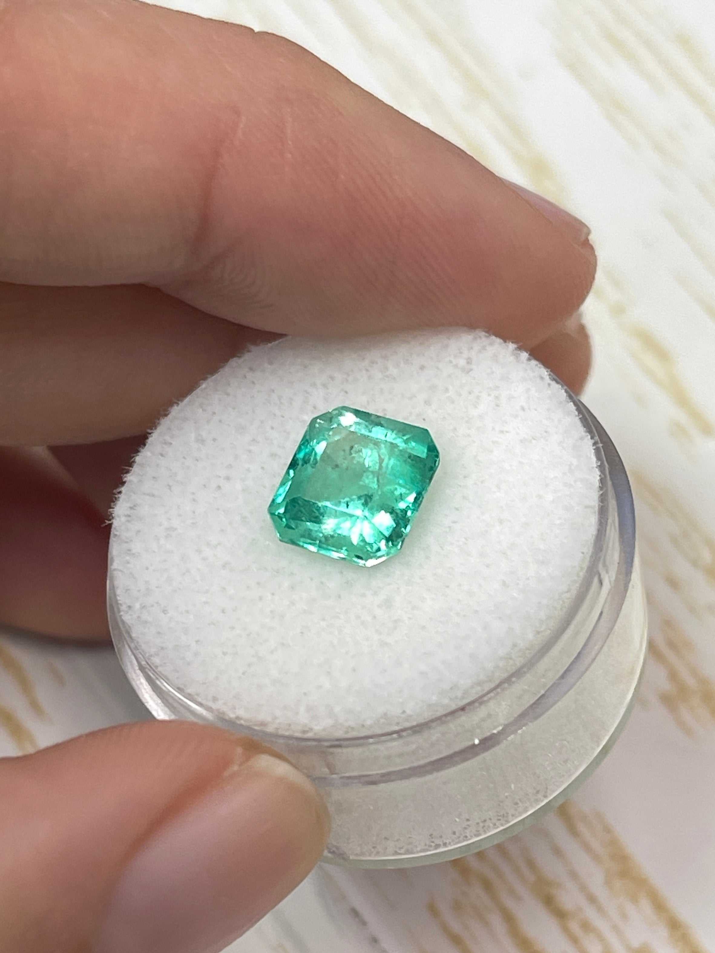 Medium green 2.73 carat Colombian emerald loose gemstone in an emerald cut, displayed by JR Colombian Emeralds.