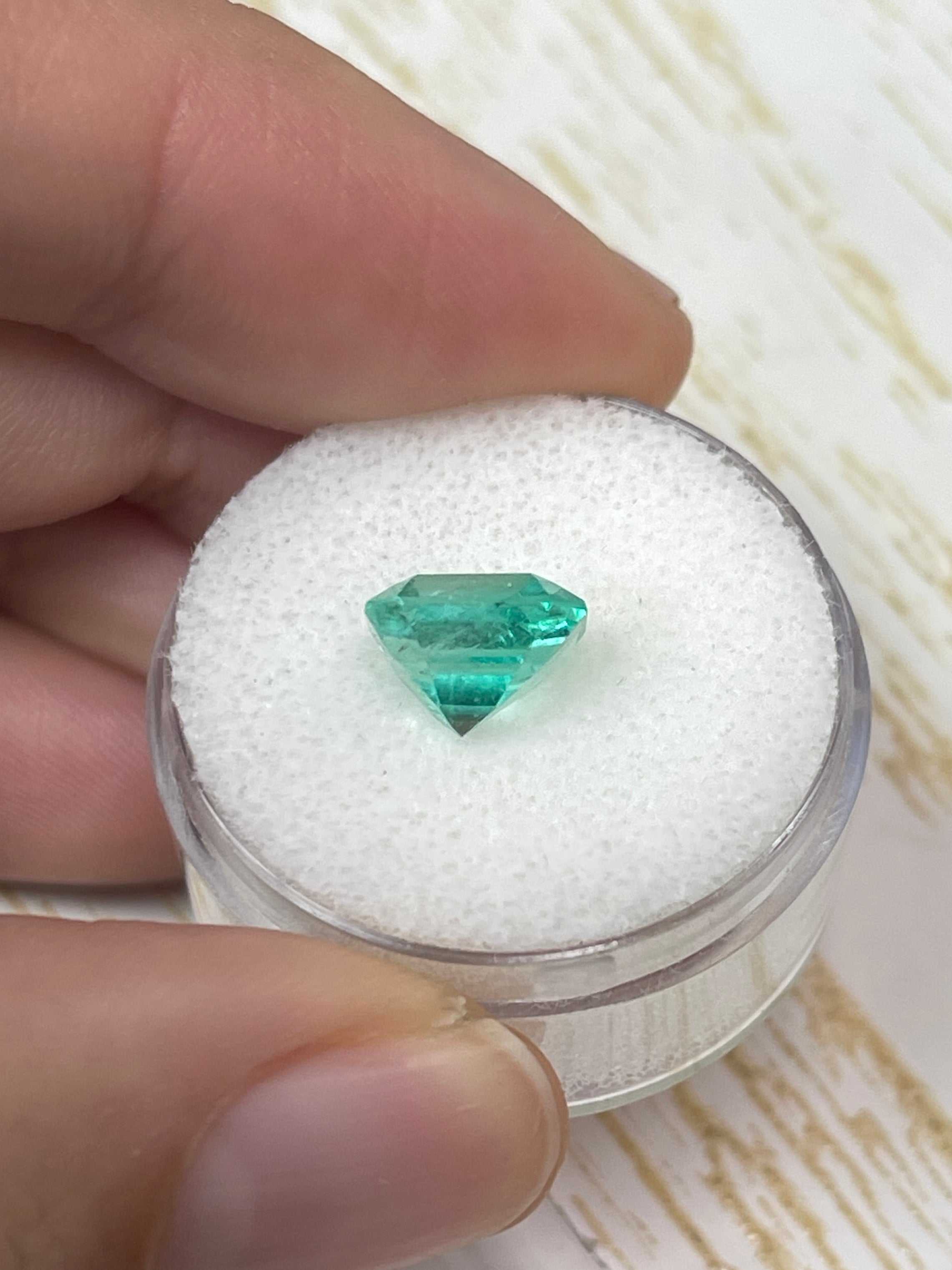 Loose 2.73 carat medium green Colombian emerald in emerald cut, natural, from JR Colombian Emeralds with a custom lab diamond solitaire ring.