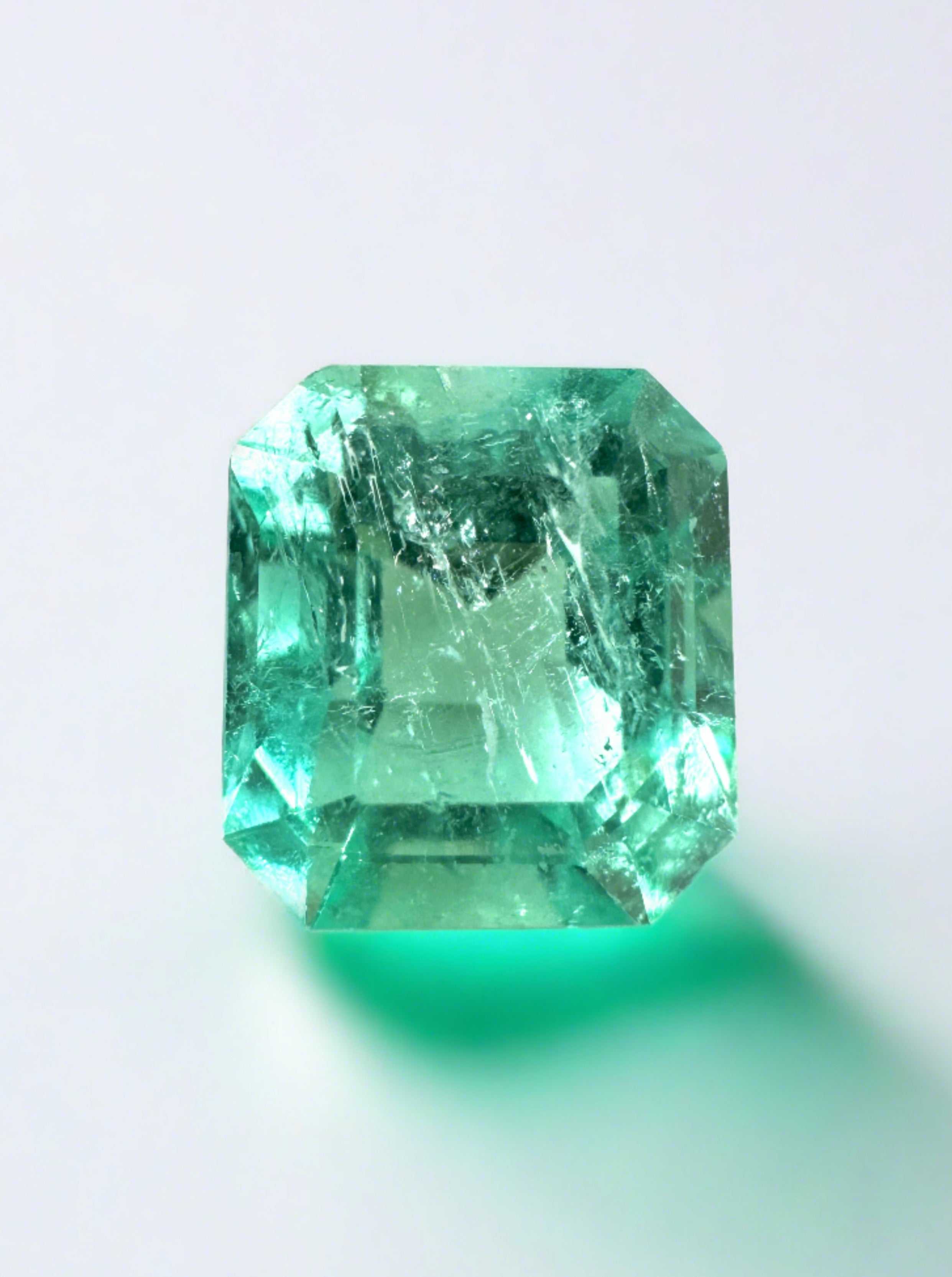 Loose 2.73-carat Colombian emerald in emerald cut with a custom lab diamond solitaire accent ring by JR Colombian Emeralds.