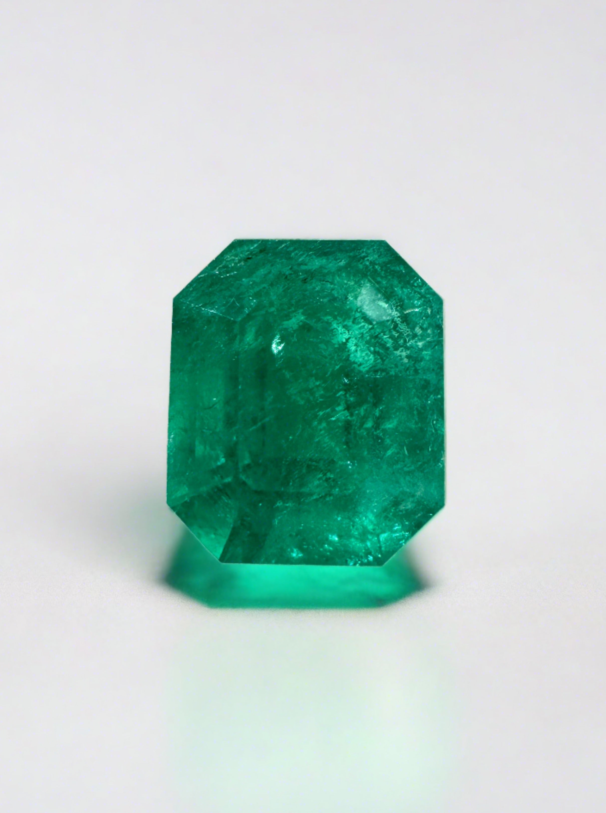 Deep bluish green 2.74 carat natural Colombian emerald in an emerald cut, showcasing its vivid color and clarity.