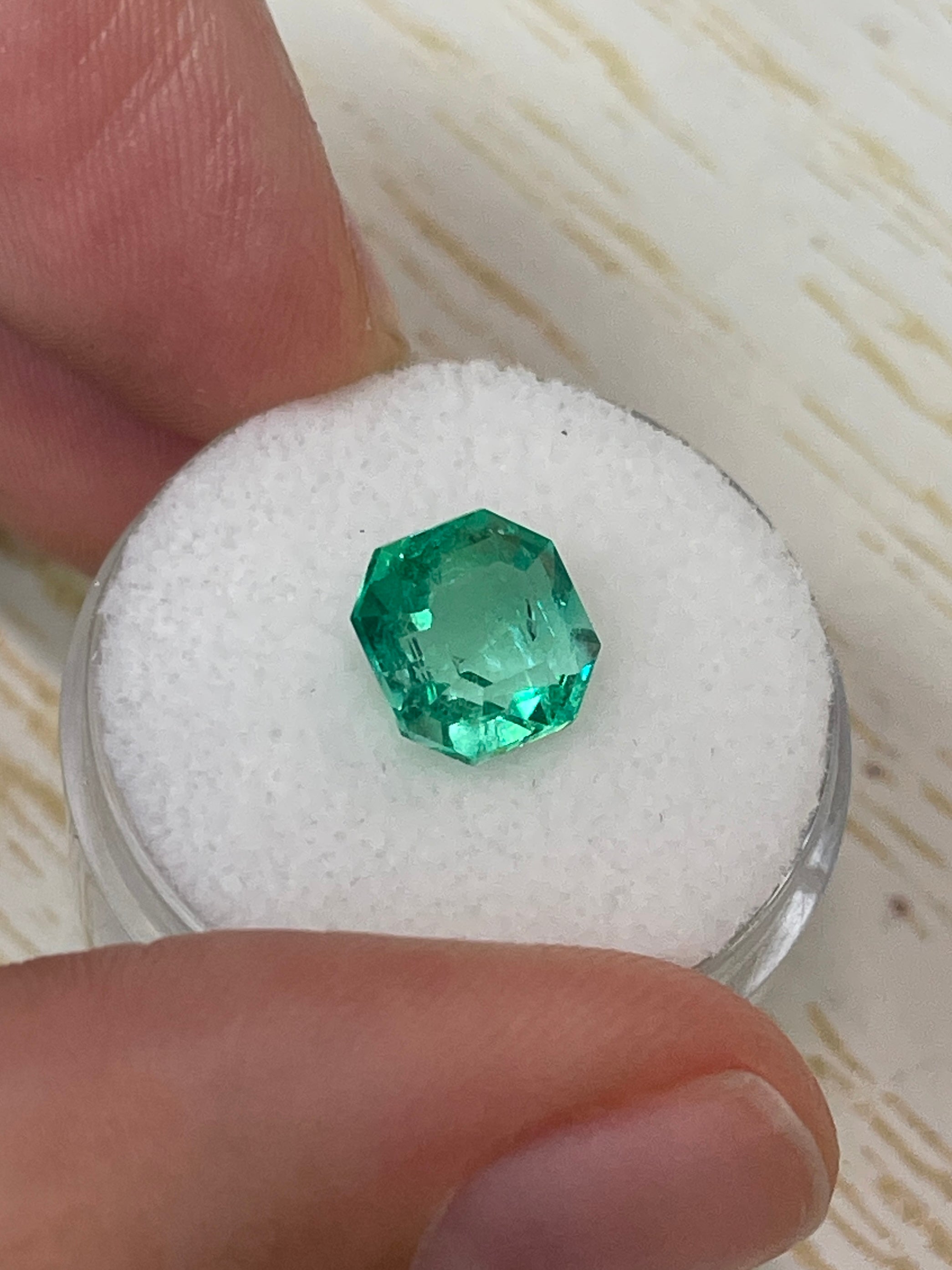 2.76 carat vivacious natural Colombian emerald loose Asscher cut with clipped corners, from JR Colombian Emeralds.