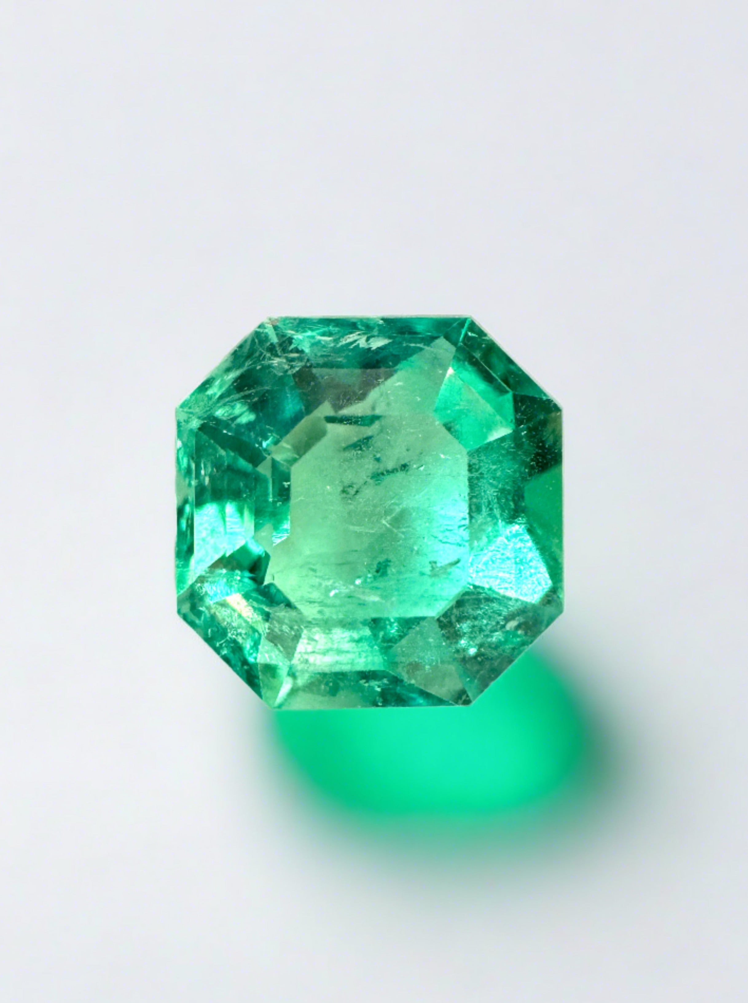 2.76 carat natural Colombian emerald loose gemstone with Asscher cut and clipped corners, vibrant and vivid green from JR Colombian Emeralds.