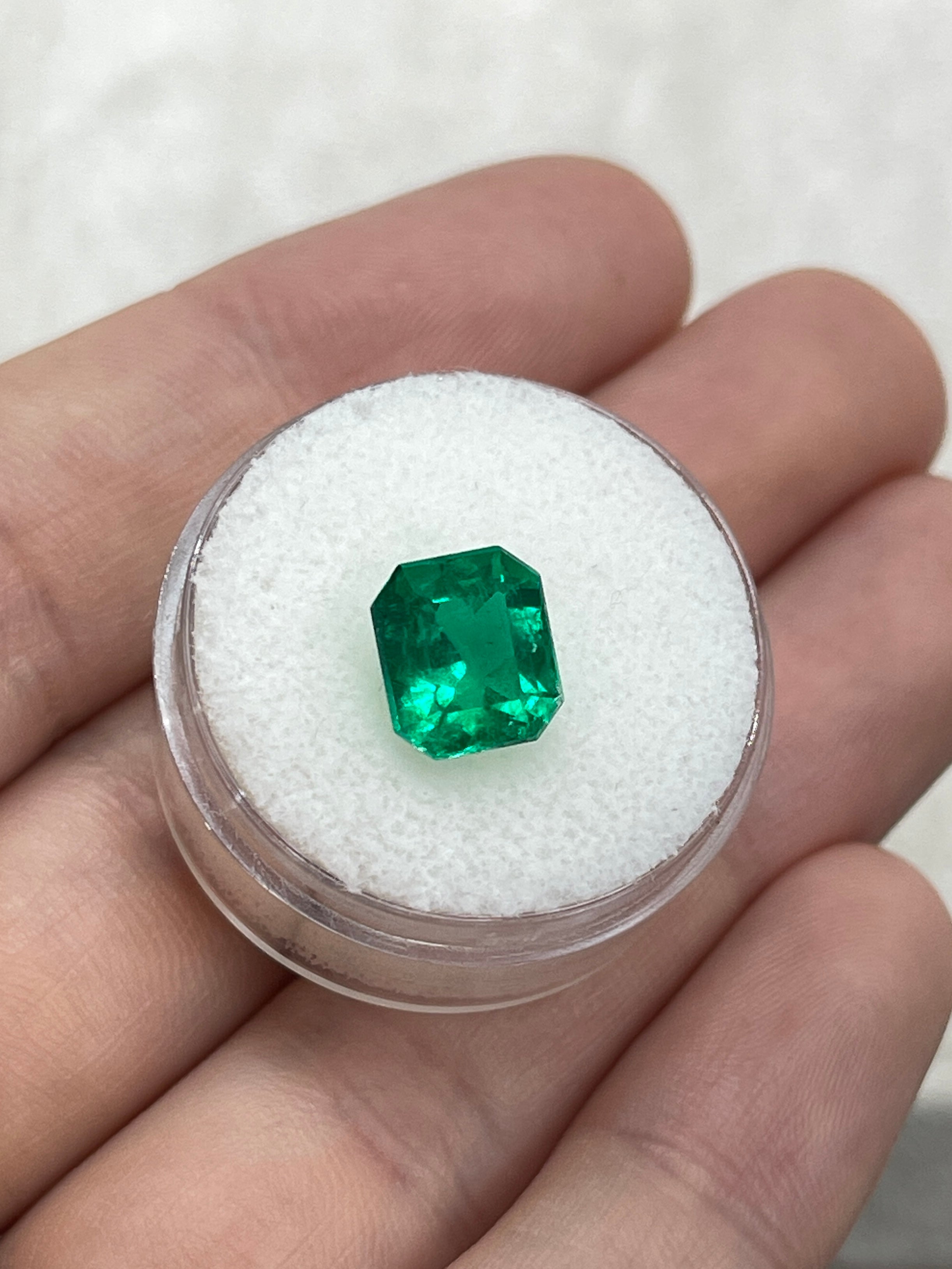 2.78 carat vivid green Colombian emerald cut loose emerald from JR Colombian Emeralds, showcasing a chunky, vibrant gemstone.