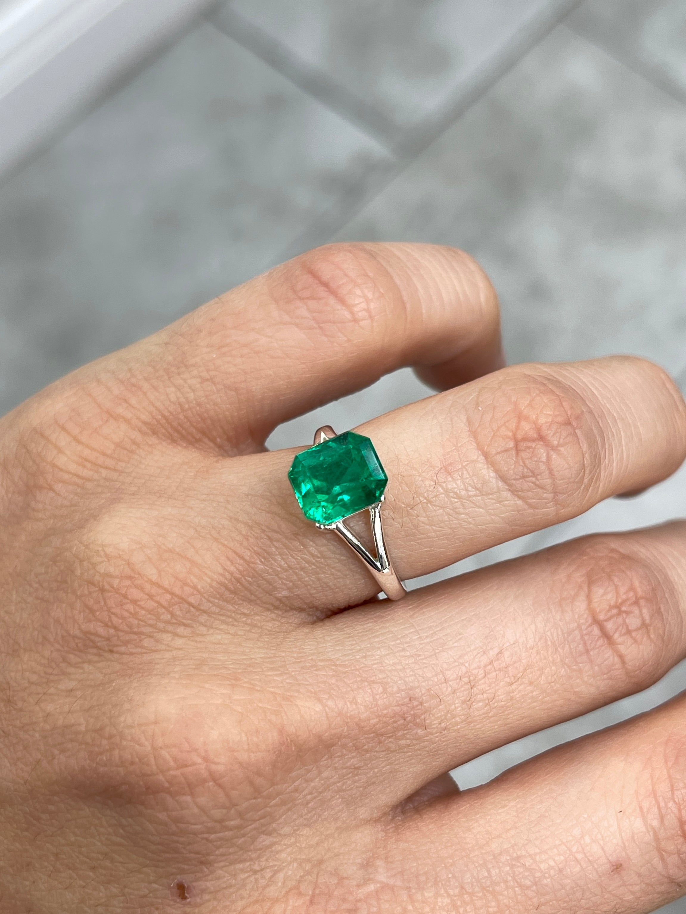 Vivid green 2.78 carat Colombian emerald cut loose emerald from JR Colombian Emeralds, showcasing a chunky rectangular shape and rich color.