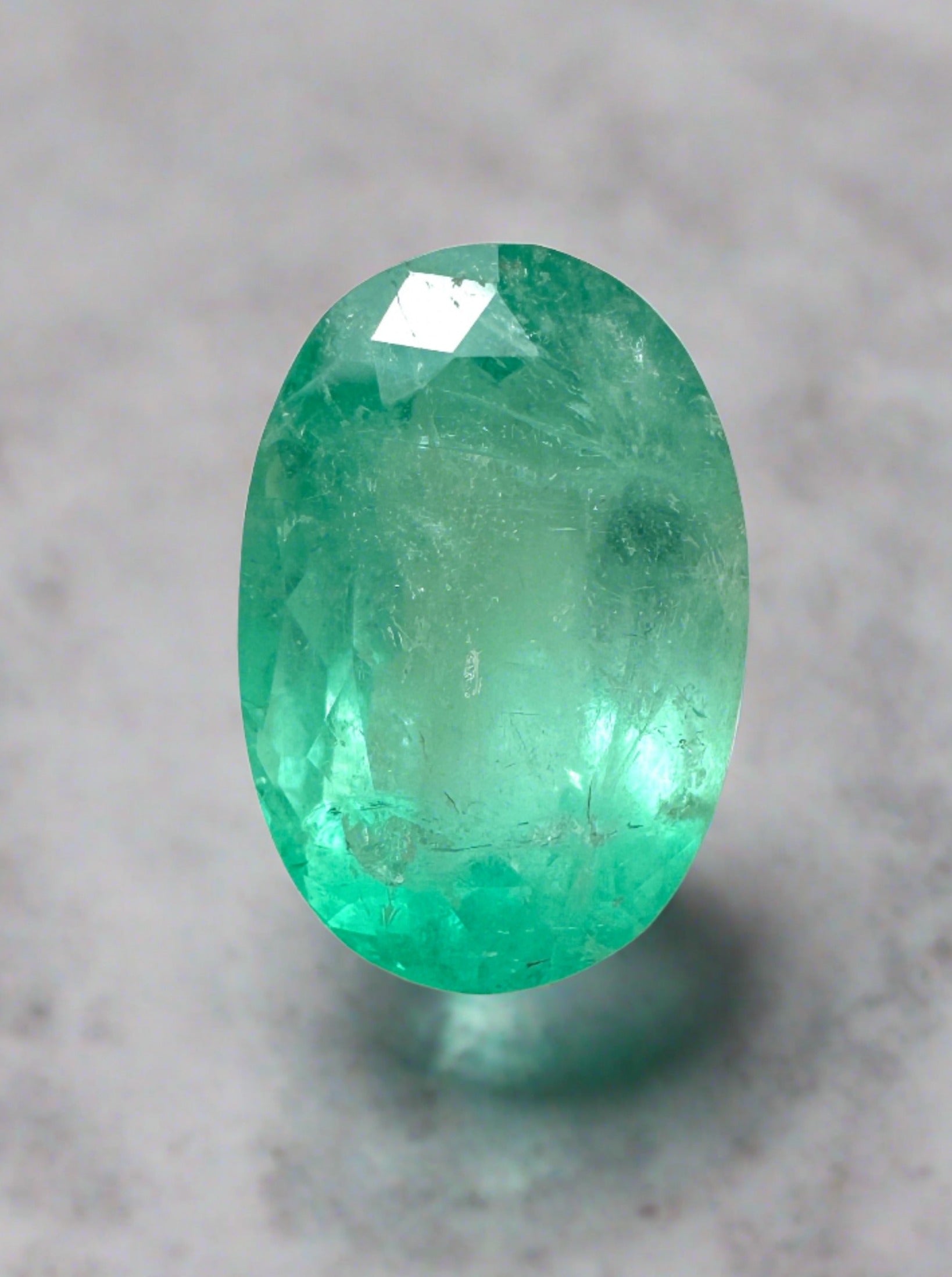 Natural loose Colombian emerald, 2.83 carats, 11x7mm oval cut, pastel mint green, from JR Colombian Emeralds.