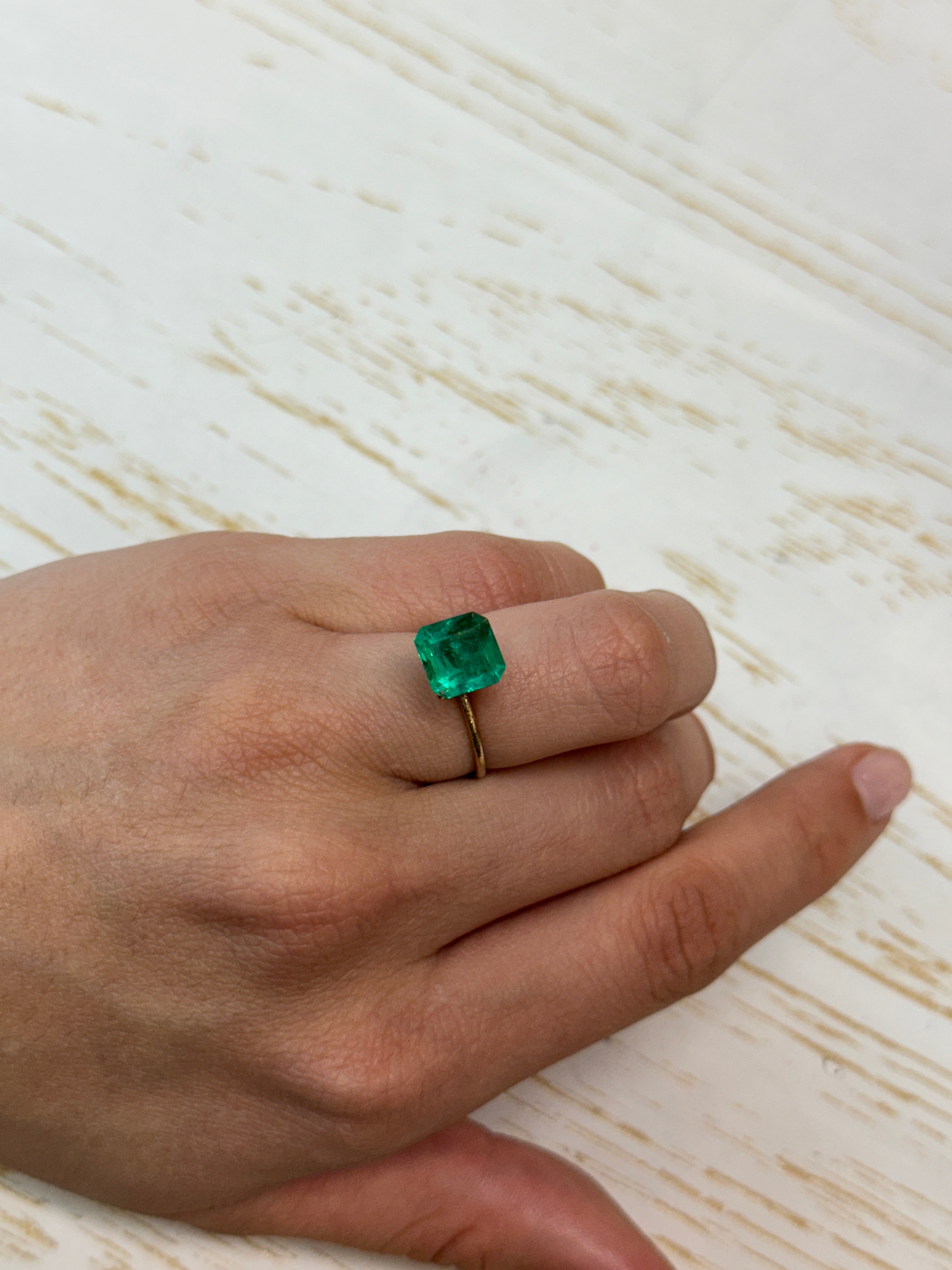 Vivid 2.84 carat Muzo Colombian emerald loose gemstone in Asscher cut, showcasing rich green color and natural clarity.