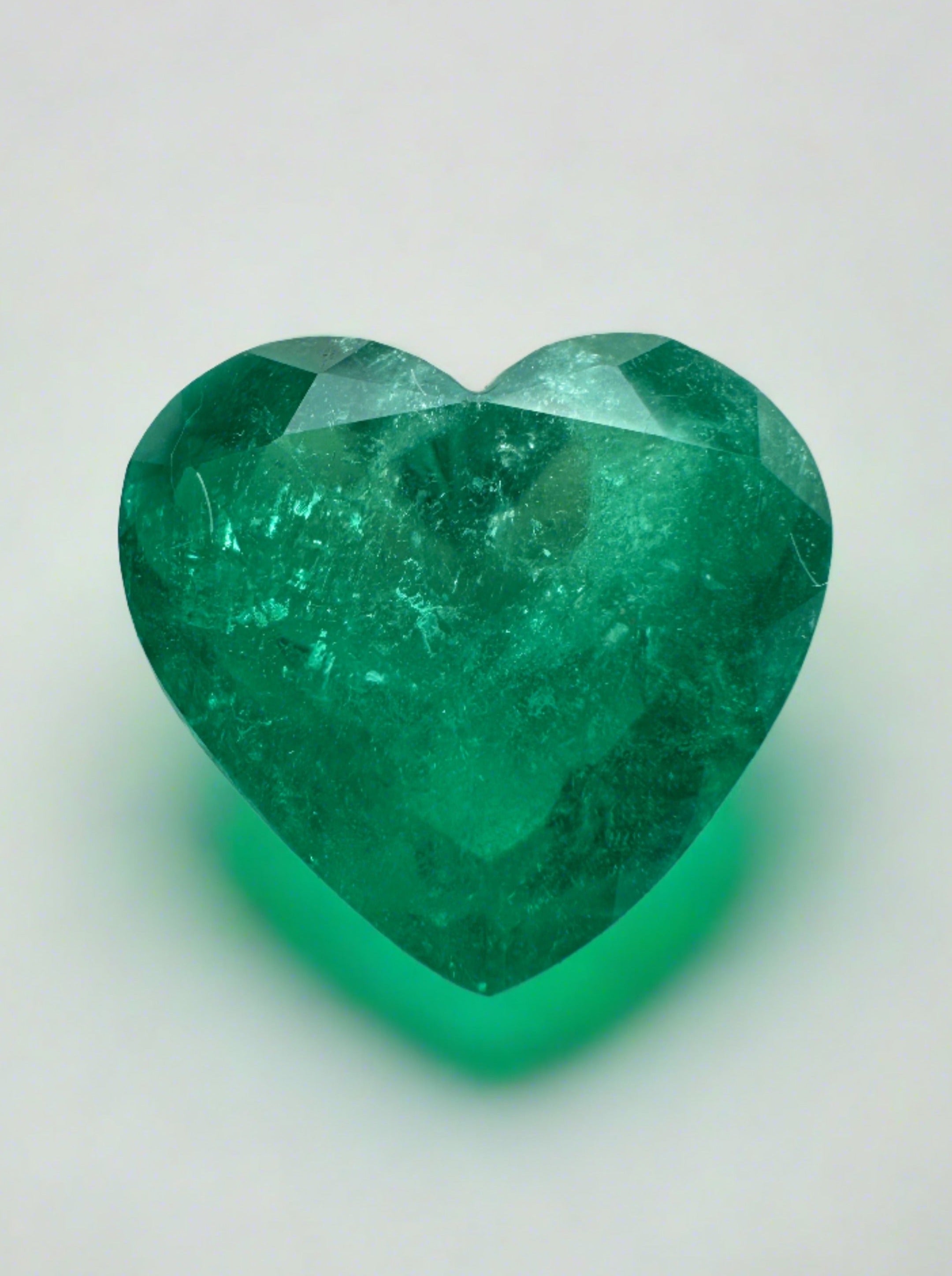 Bright green 2.87 carat natural Colombian emerald loose with heart cut, showcasing vibrant color and clarity from JR Colombian Emeralds.