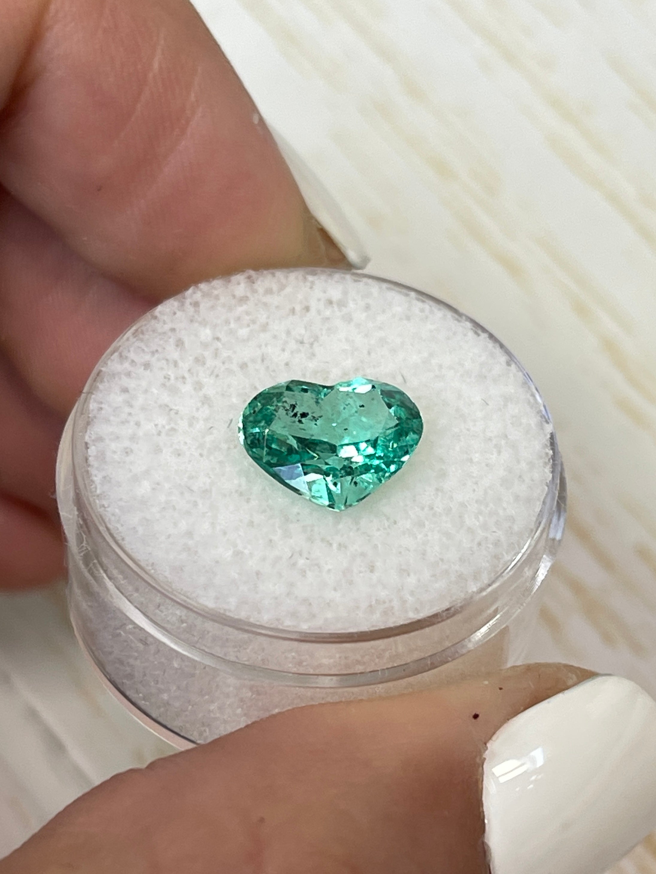 Lustrous 2.87 carat natural Colombian emerald loose gemstone, heart cut, vibrant green color, from JR Colombian Emeralds.