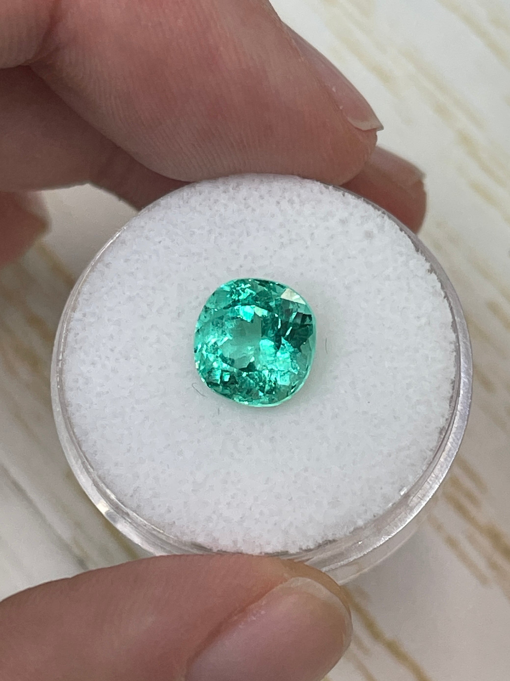 VVS 2.93 carat natural Colombian emerald cushion cut loose gemstone with vibrant green color and high clarity.