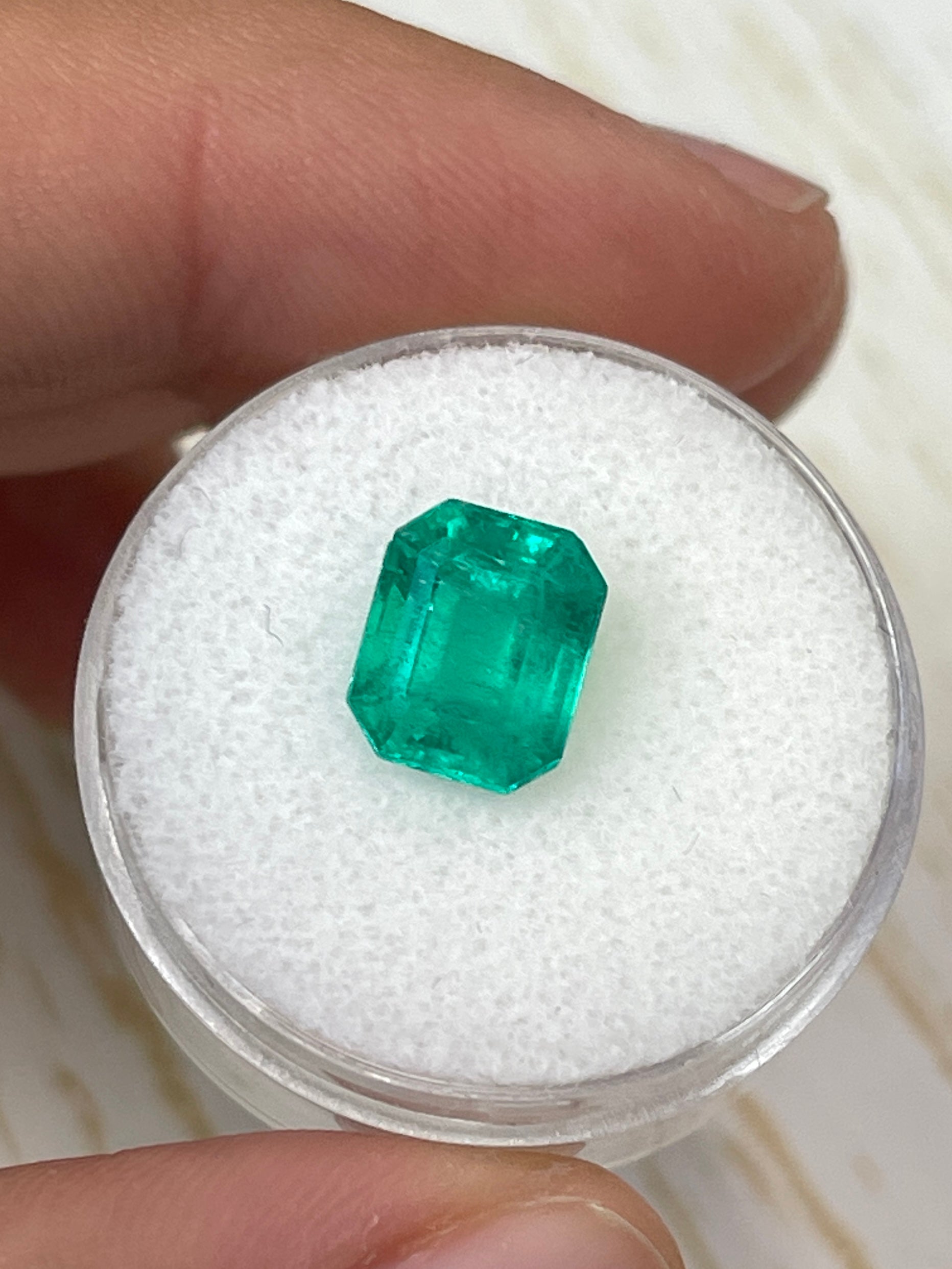Natural 2.93 carat 9x8 emerald cut Colombian emerald loose gemstone from JR Colombian Emeralds, showcasing vibrant green color and clarity.