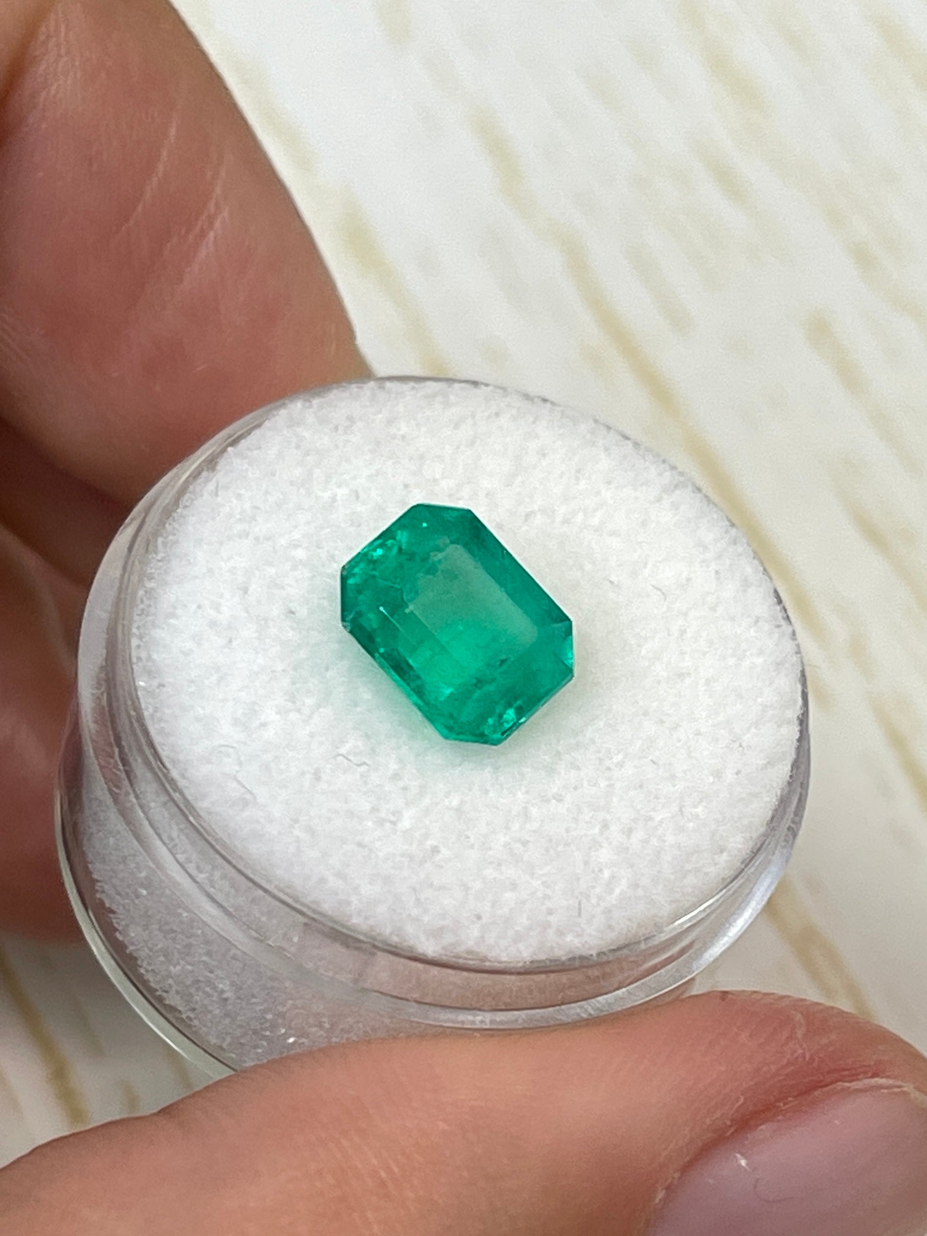 2.93 carat natural Colombian emerald loose gemstone in 9x8 emerald cut, showcasing vibrant green color and clarity.
