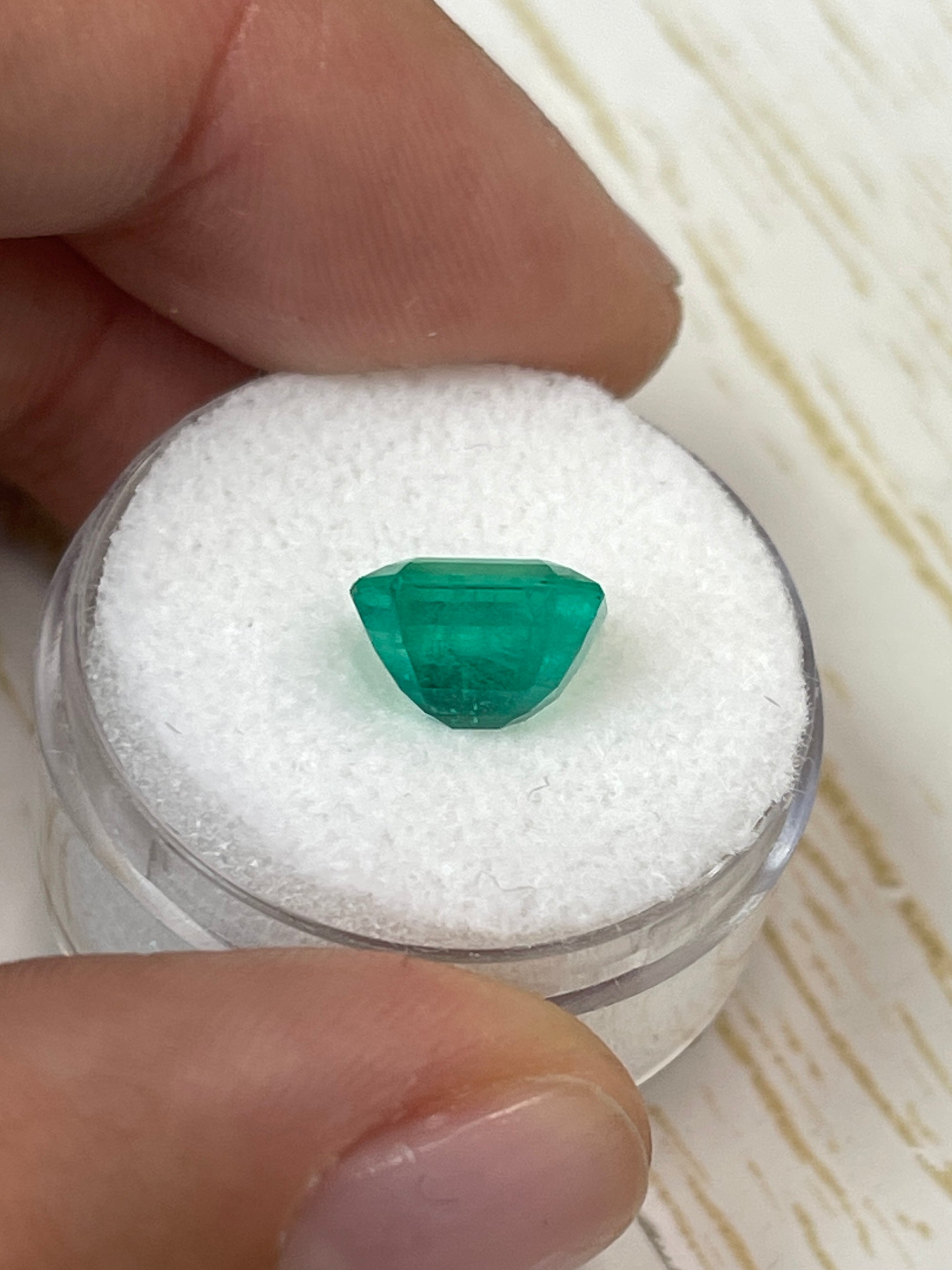 2.93 carat natural Colombian emerald loose gemstone in emerald cut, showcasing vibrant green color and clarity.