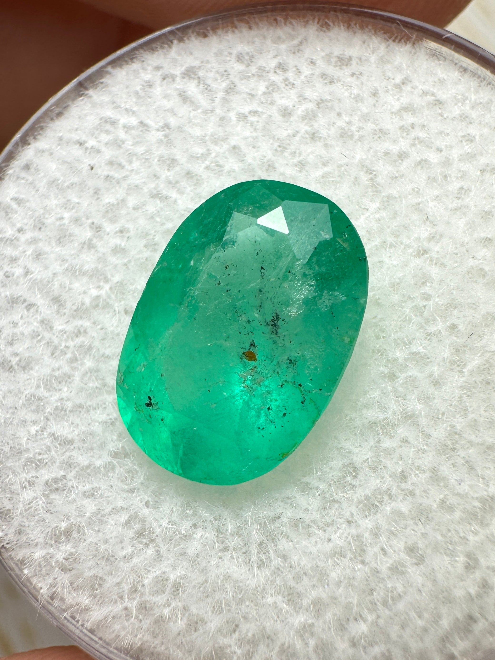 Medium green 2.95 carat Colombian Emerald loose oval cut with natural freckles, from JR Colombian Emeralds.