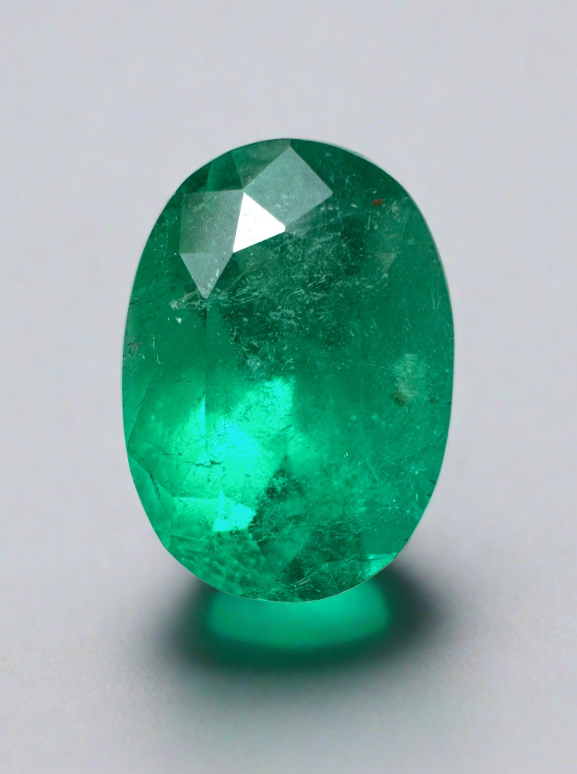 Elongated 2.95 carat semi-transparent green Colombian Emerald loose oval cut gemstone from JR Colombian Emeralds.