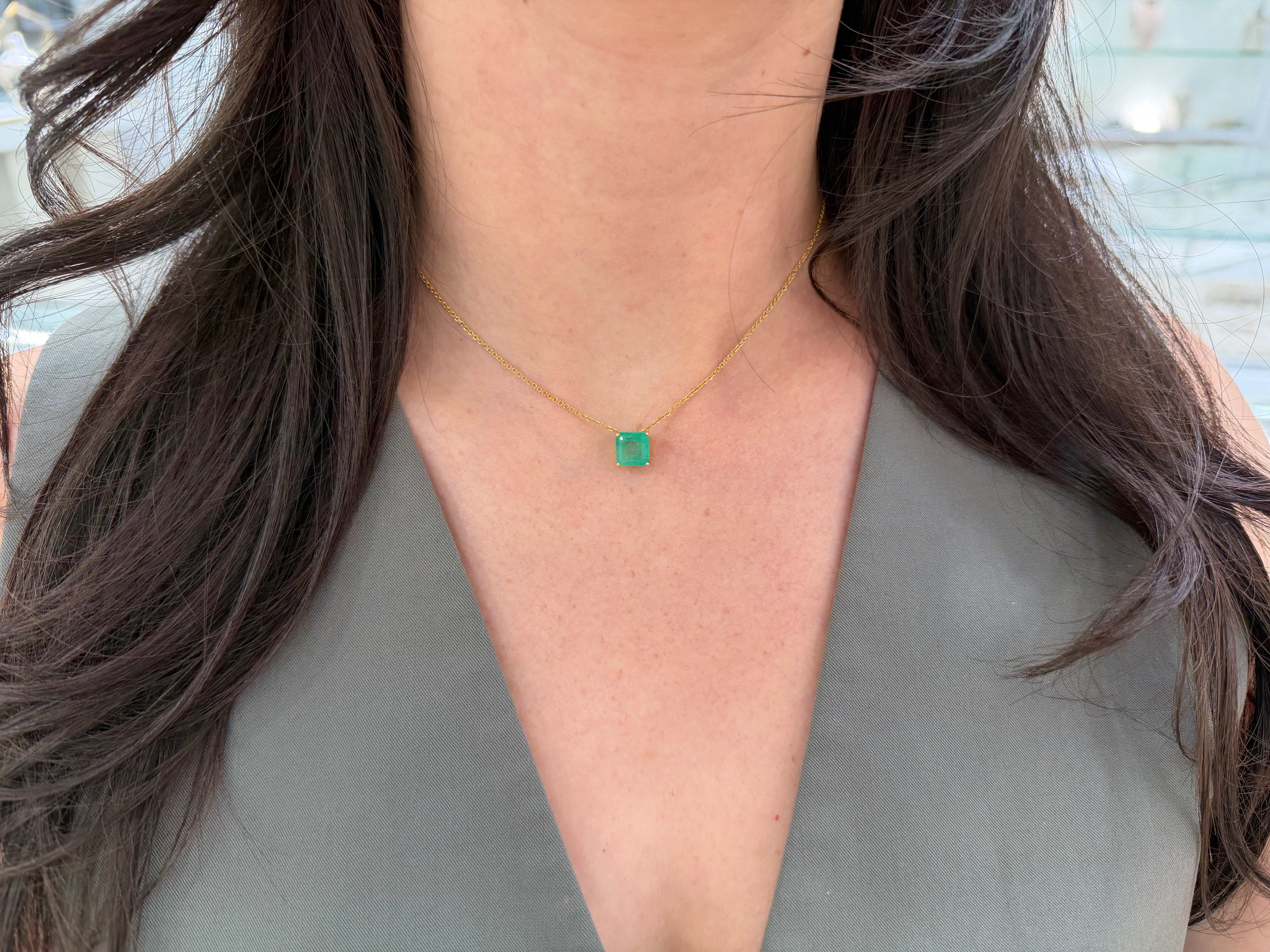 Asscher cut Colombian emerald sliding necklace with 3.0 carats in 14K gold, featuring a vibrant green gemstone and delicate chain.