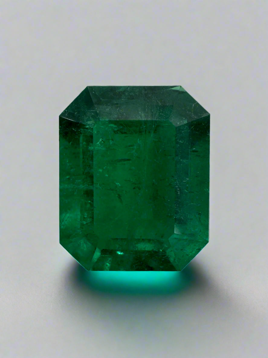 Vivid 3.08 carat Muzo green Colombian emerald loose gemstone in an emerald cut, displayed on a white background.