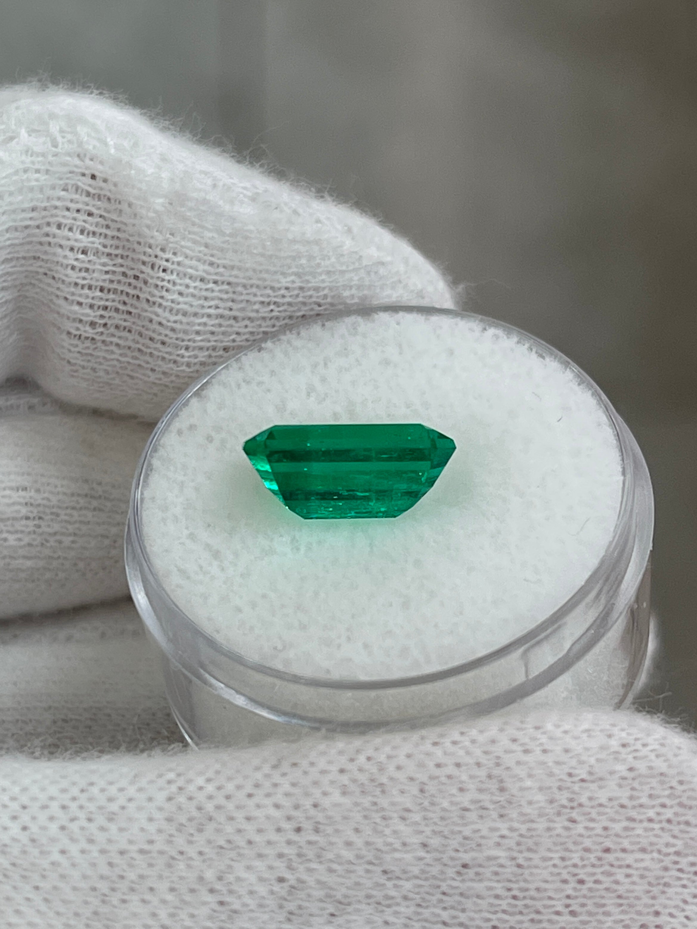 3.10 carat AAA+ Colombian emerald loose gemstone, elongated emerald cut with minor oil treatment, from JR Colombian Emeralds.