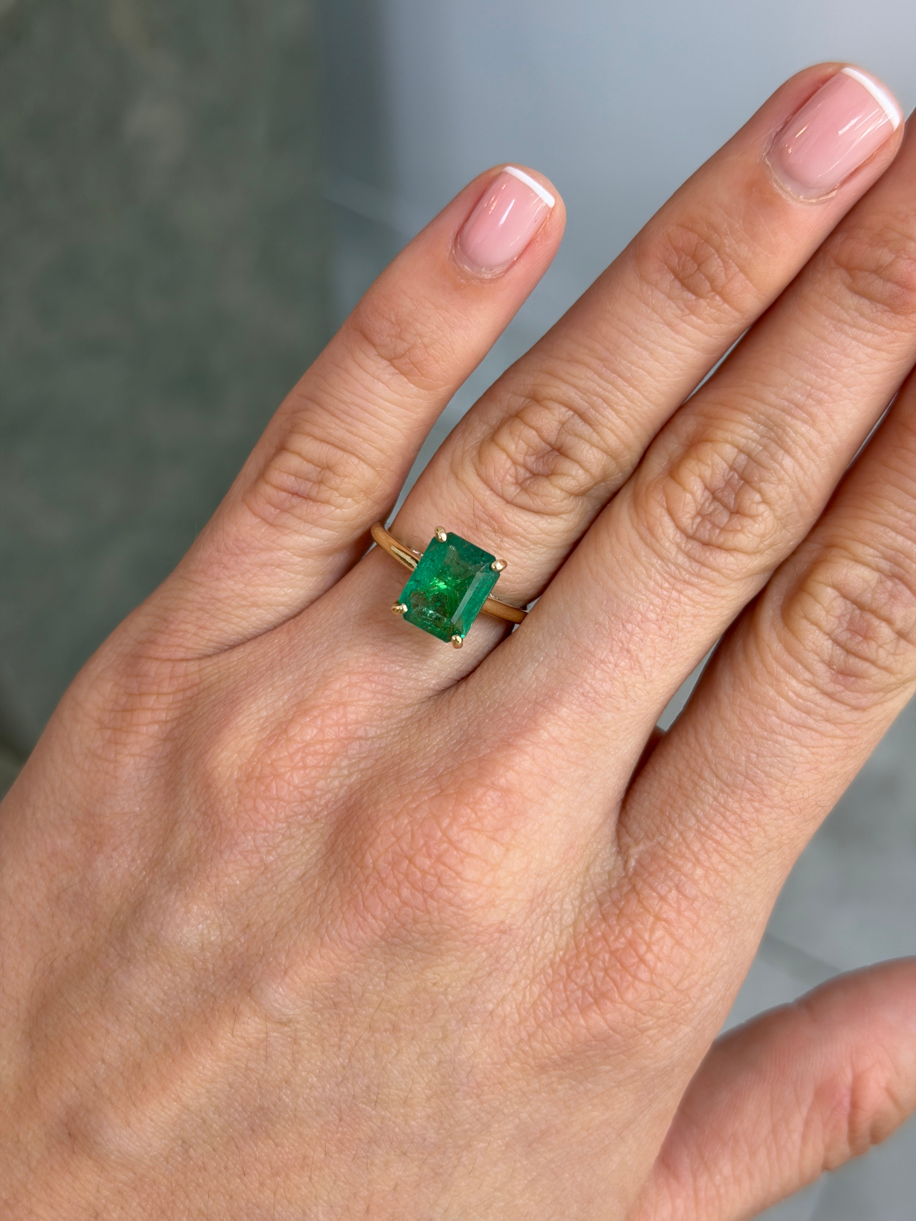14K gold emerald cut emerald engagement ring with hidden diamonds, featuring a 3.20 carat natural emerald from JR Colombian Emeralds